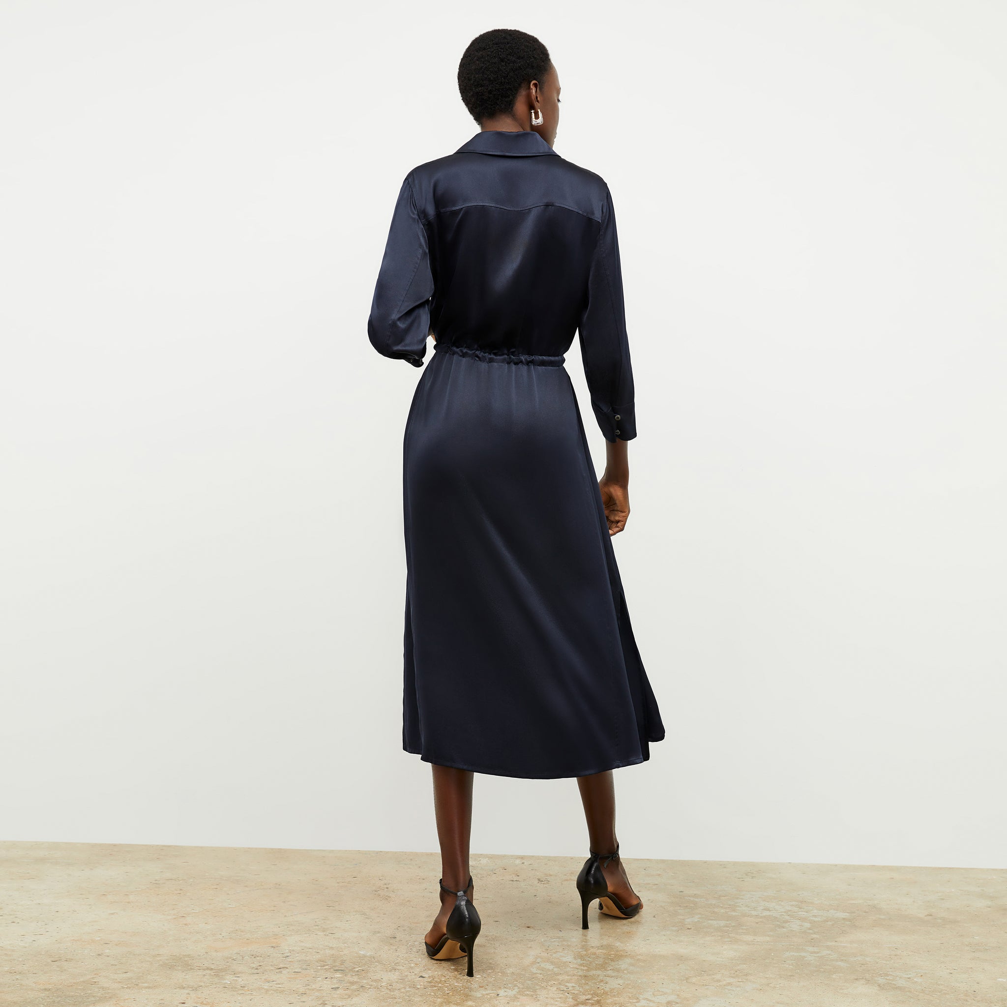 Back image of a woman wearing the Pepper Dress in Galaxy Blue 