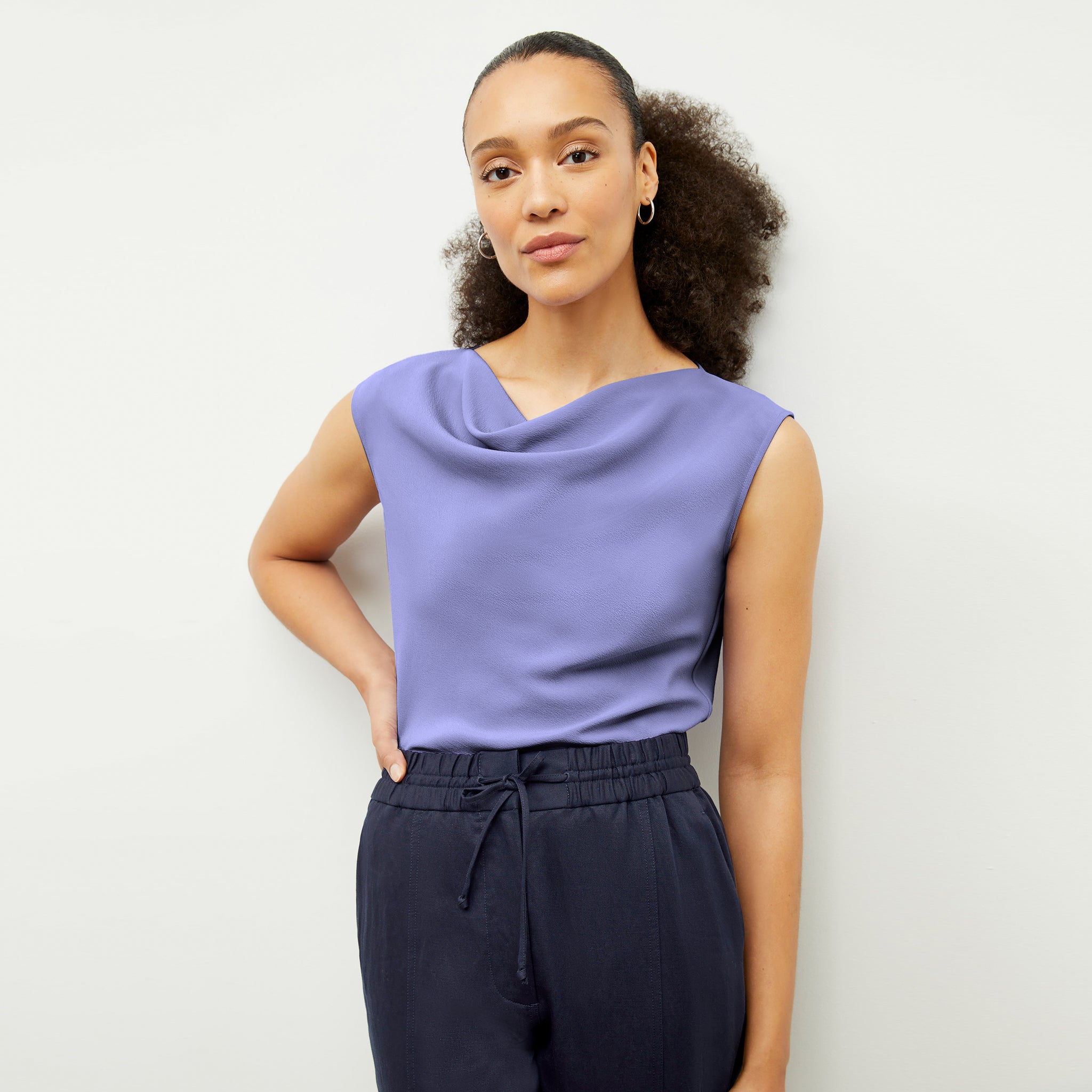 Front image of a woman wearing the Nora Top in Iris 