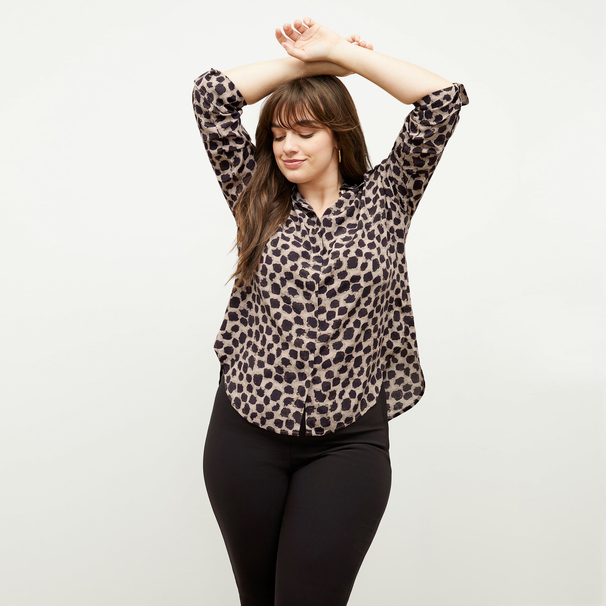 Front image of a woman wearing the tatum shirt in sahara print