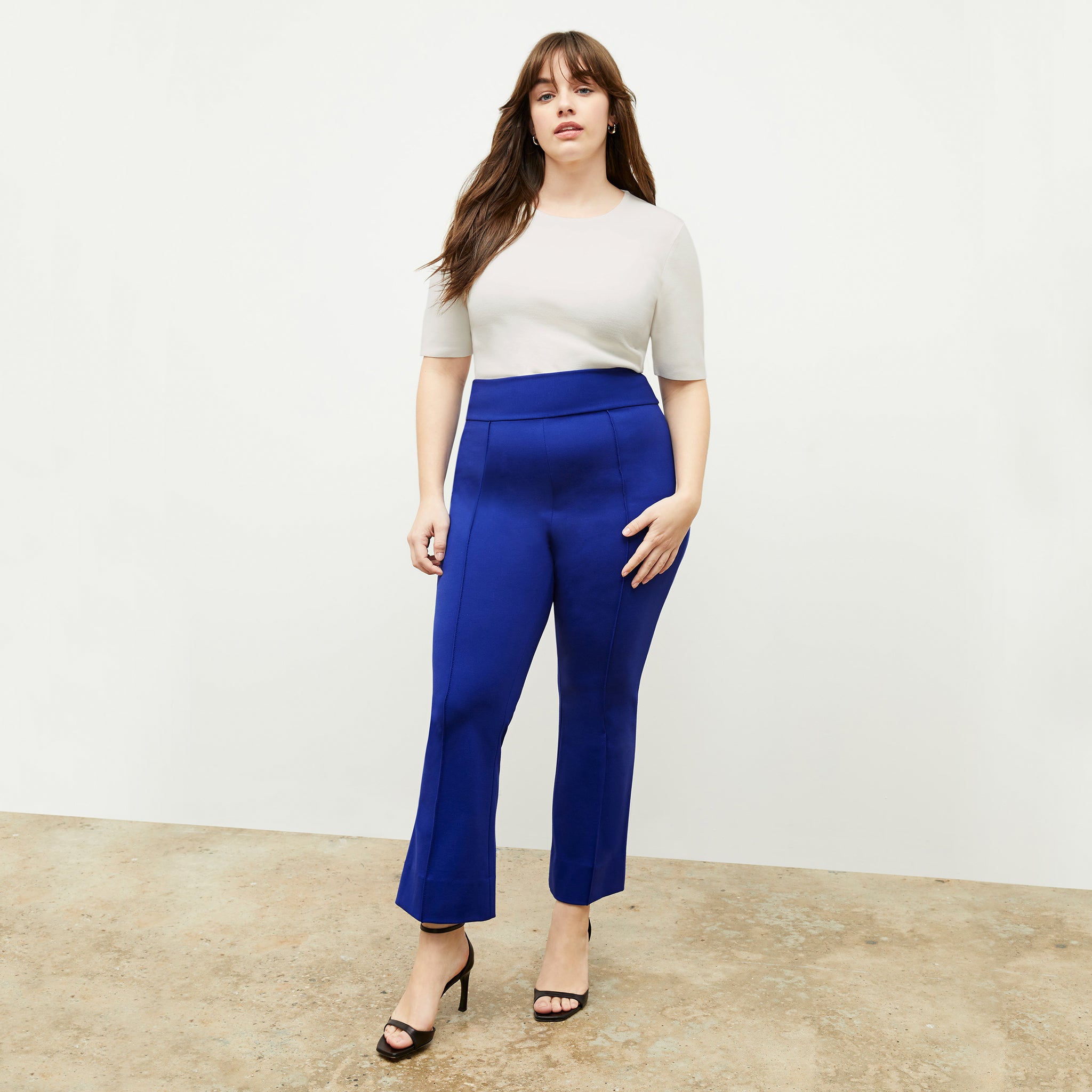 front image of a woman wearing the allyn pants in electric blue