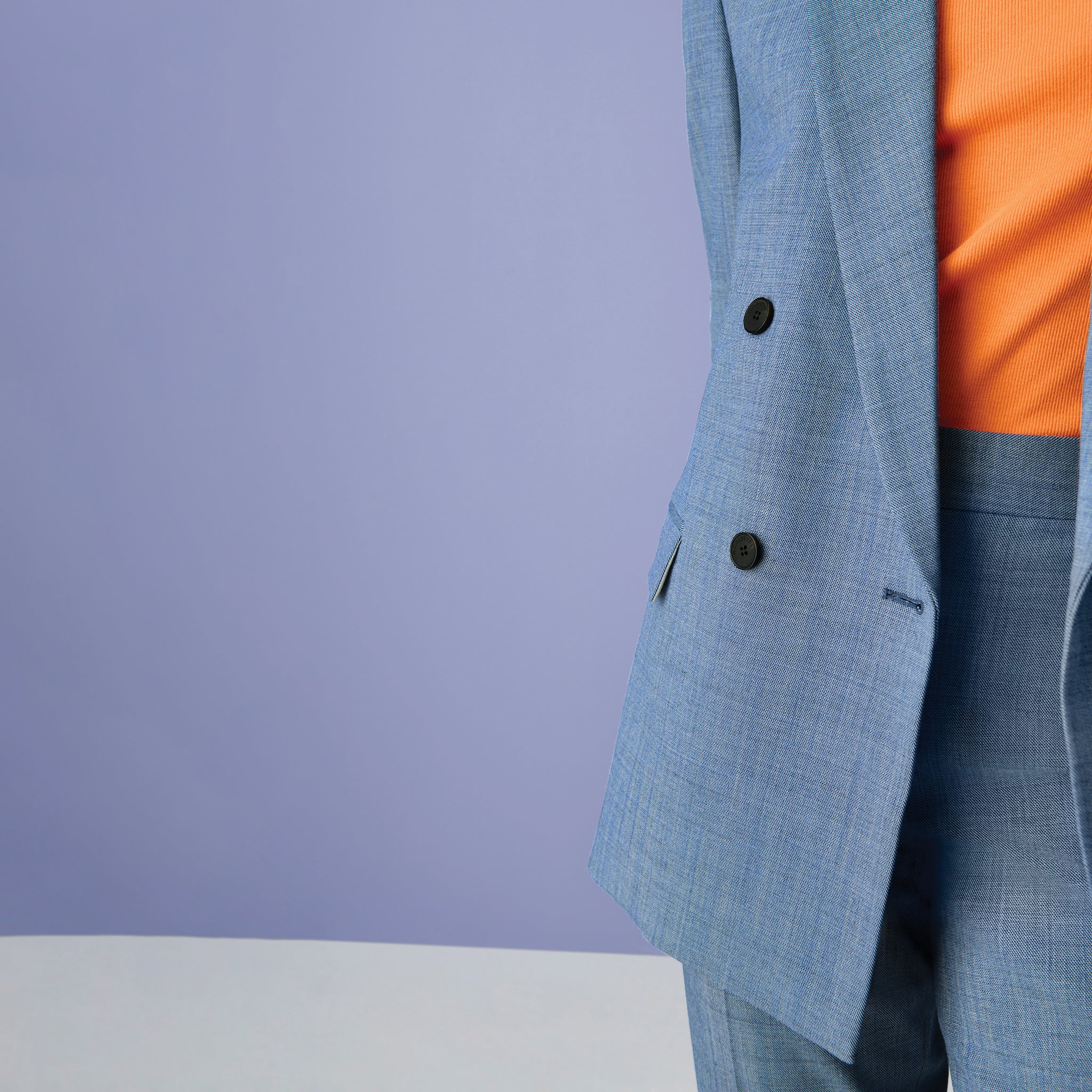 Front image of a woman wearing the paige tank in clementine