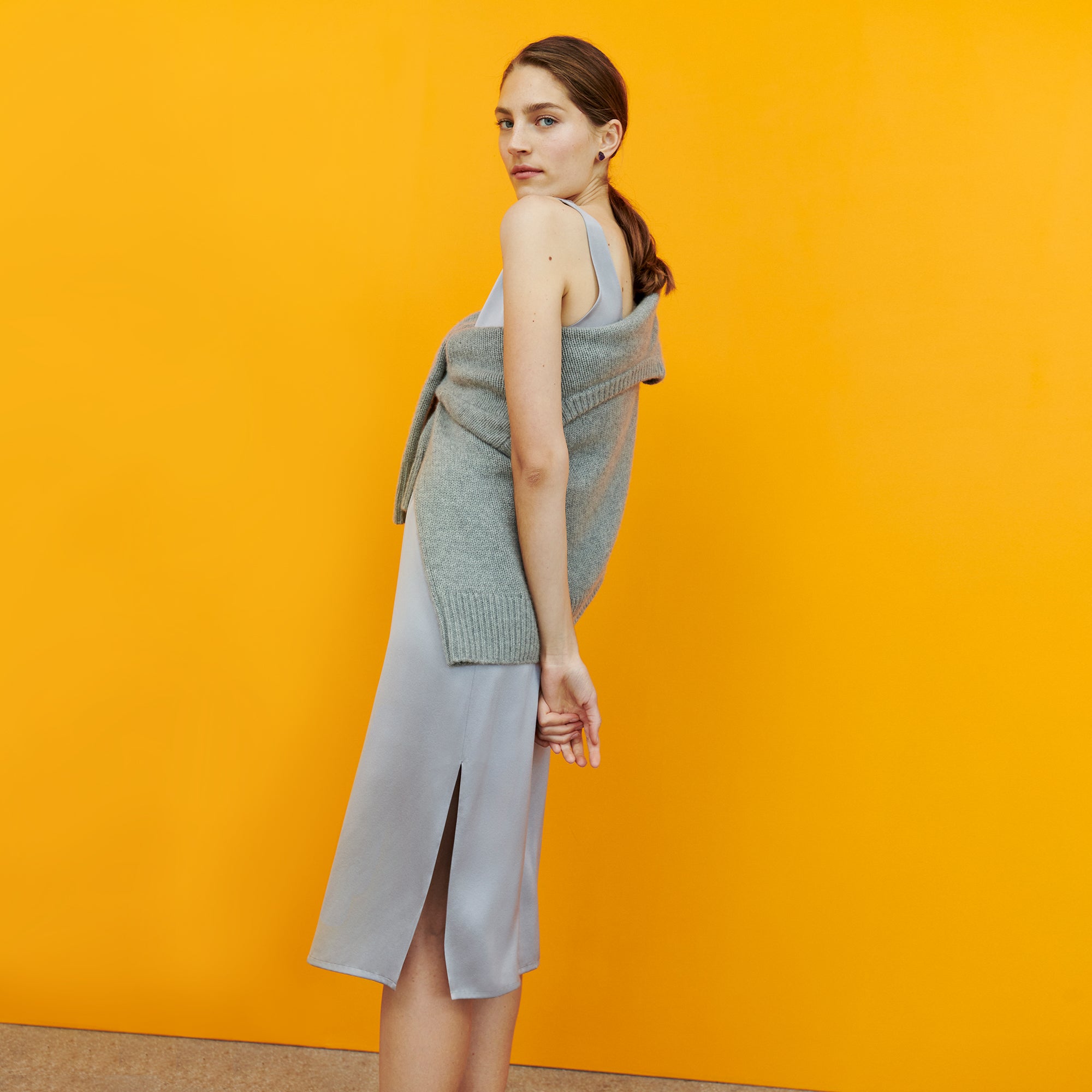 Side image of a woman wearing the Bevin Dress - Washable Silk Charmeuse in Wisteria