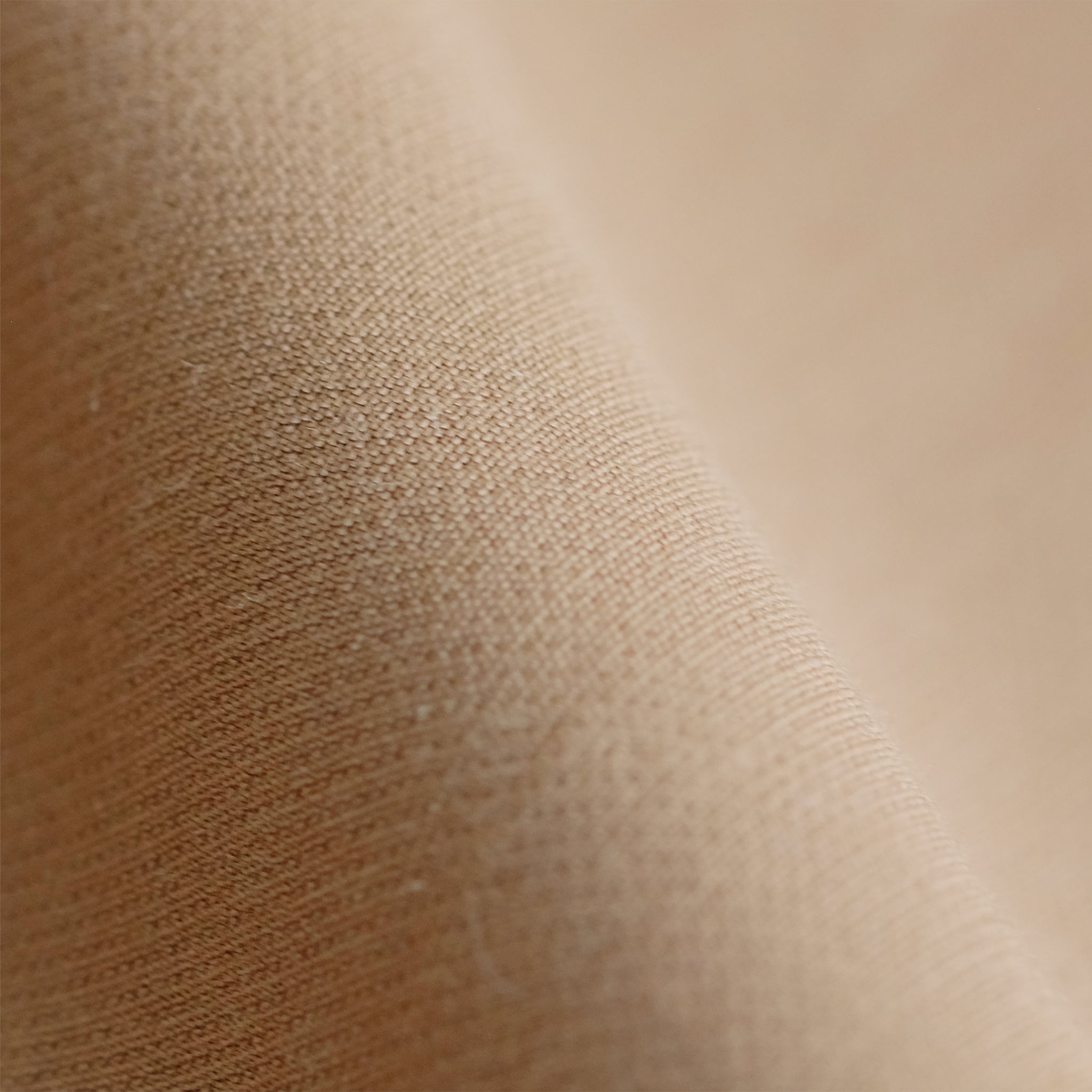 Close up image of wool twill fabric in camel