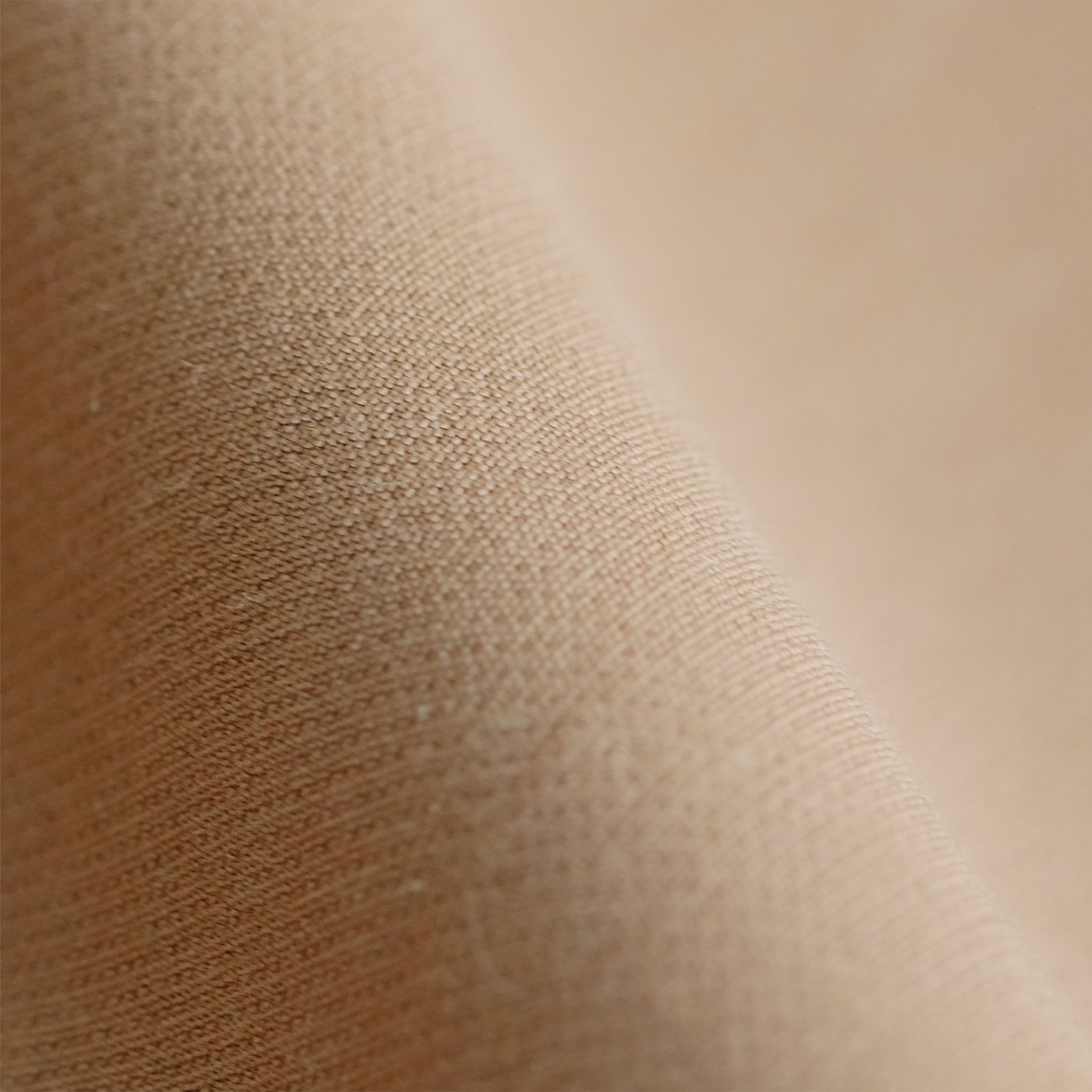 Close up image of wool twill fabric in camel