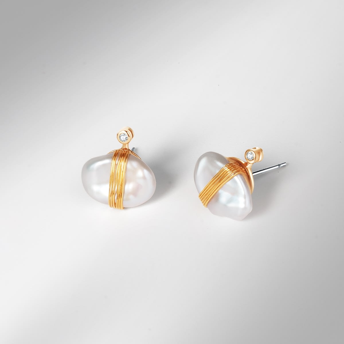 Pack shot image of the Amari Earrings in gold 