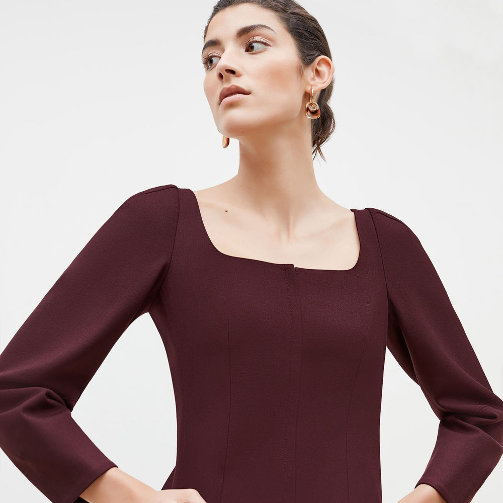 Detail image of a woman standing wearing the Dawn Top-Sharkskin in garnet