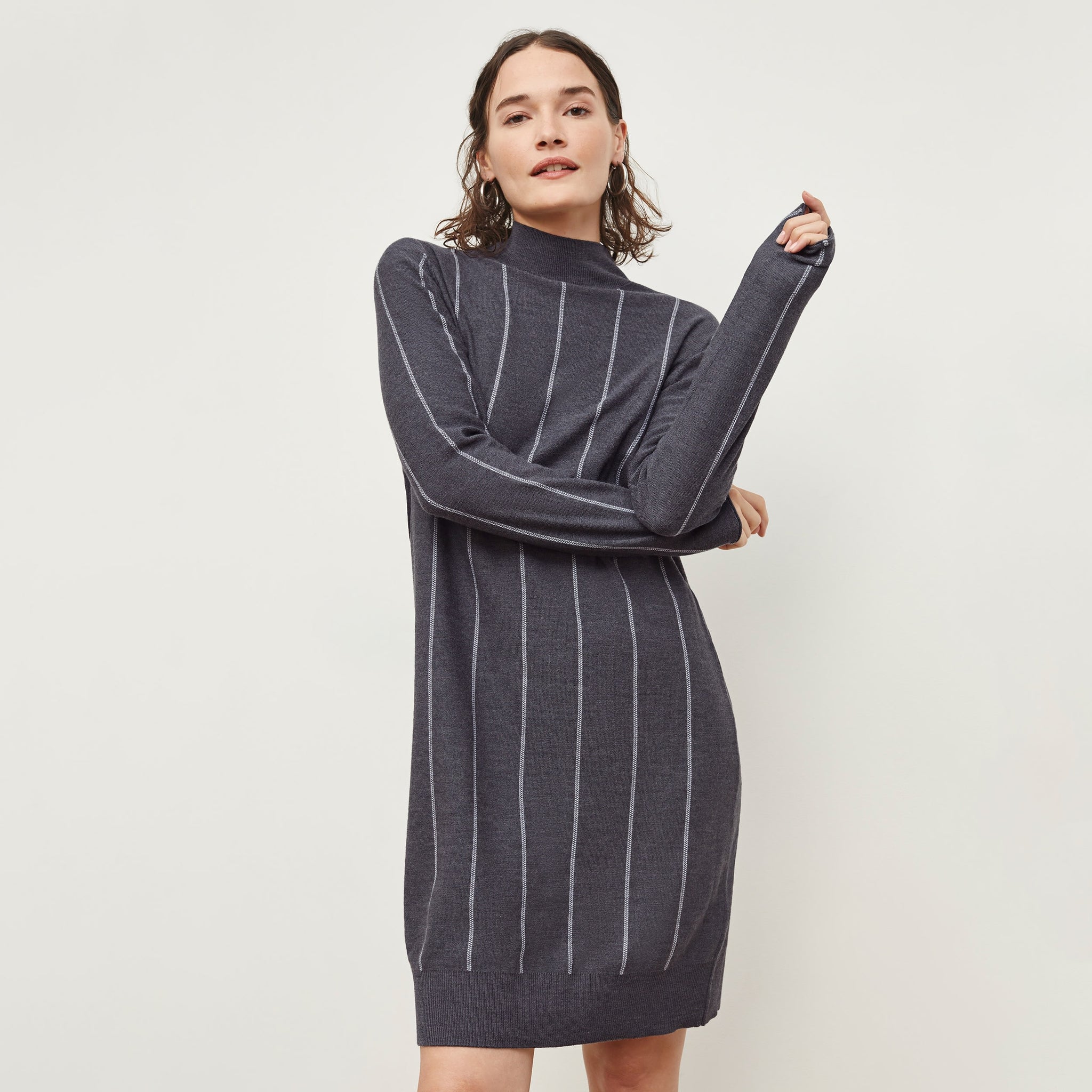 Front image of a woman standing wearing the Effy Dress—Braided Stripe in Charcoal / Ivory 