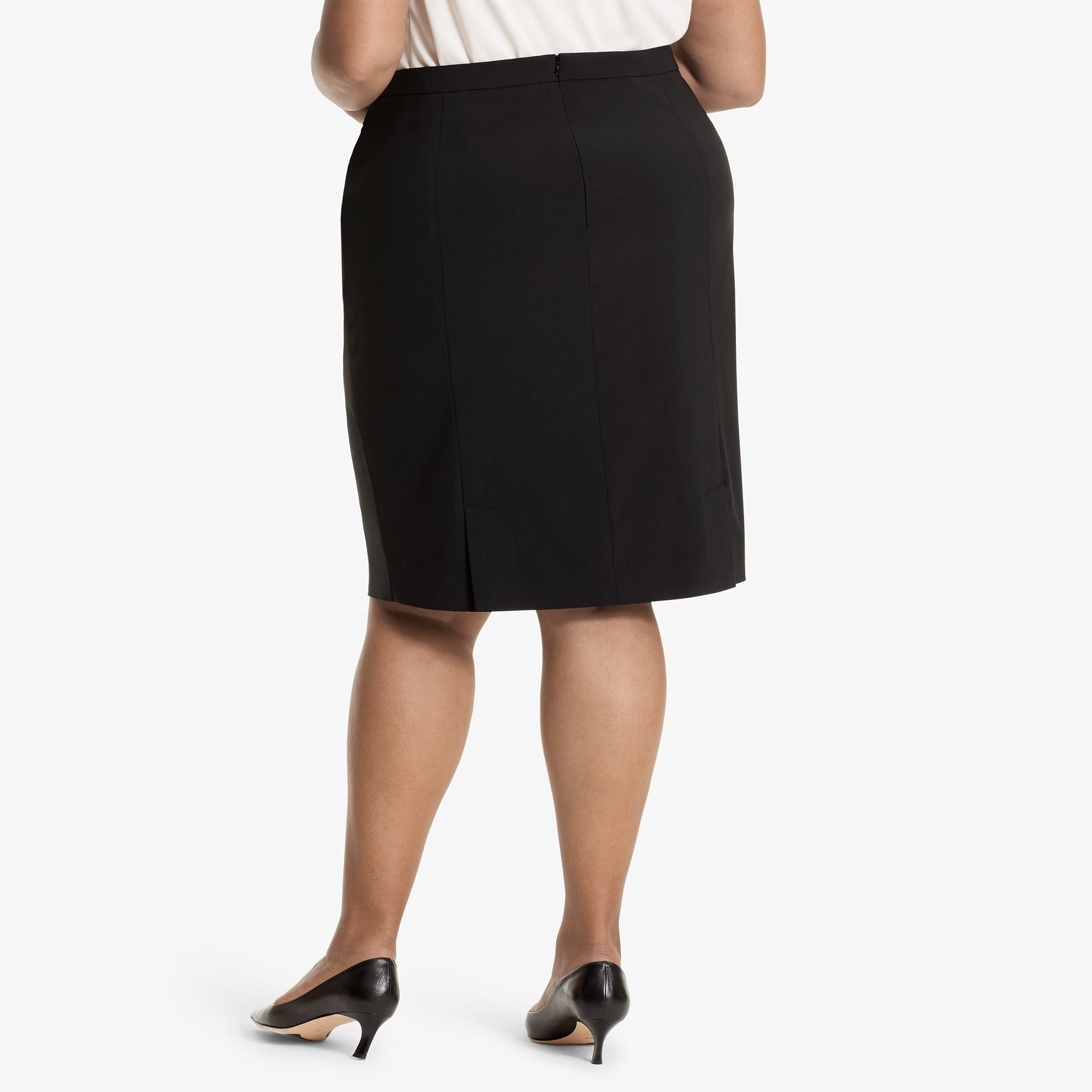Back image of a woman standing wearing the Cobble hill skirt in Black