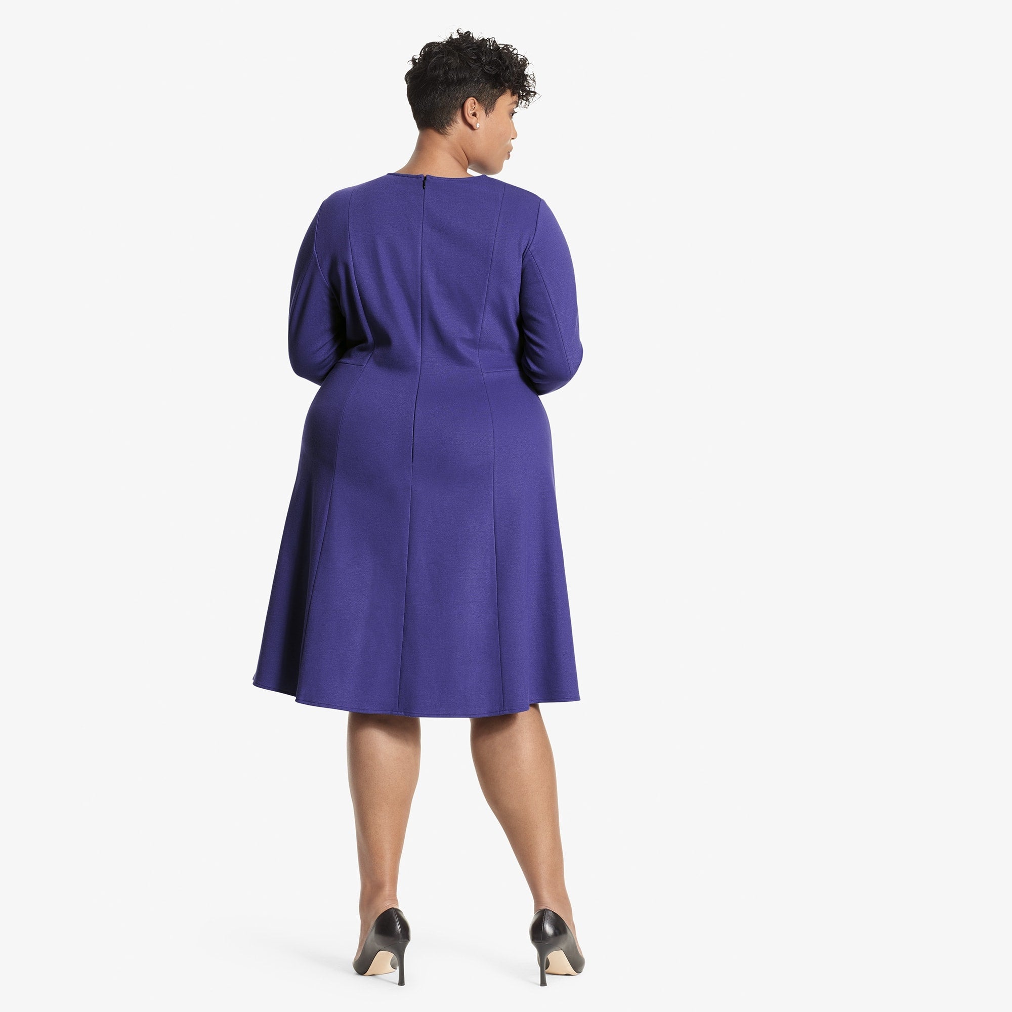 Back image of a woman standing wearing the Ellis dress textured ponte in Violet
