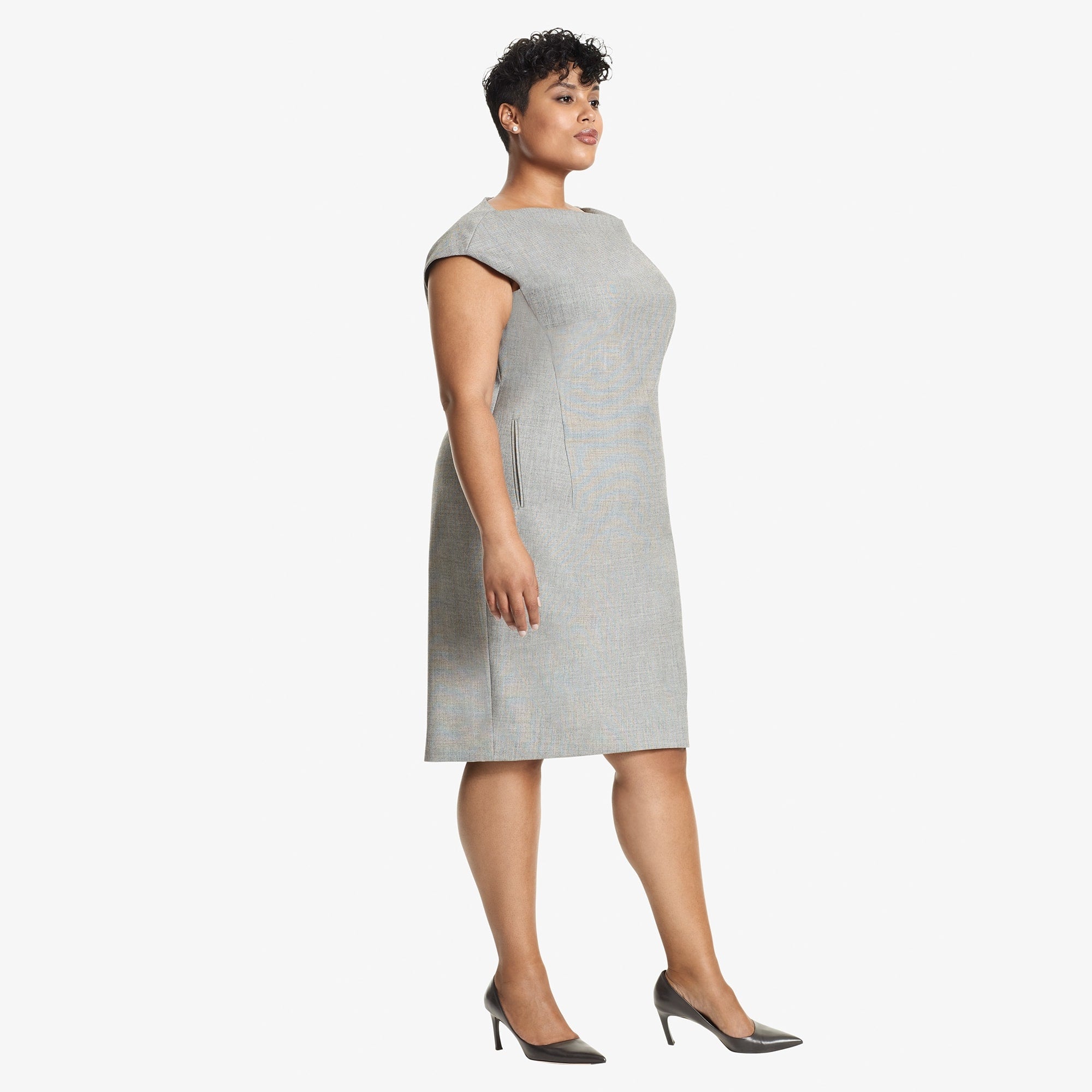 Side image of a woman standing wearing the Marilyn Dress Sharkskin in Black and White