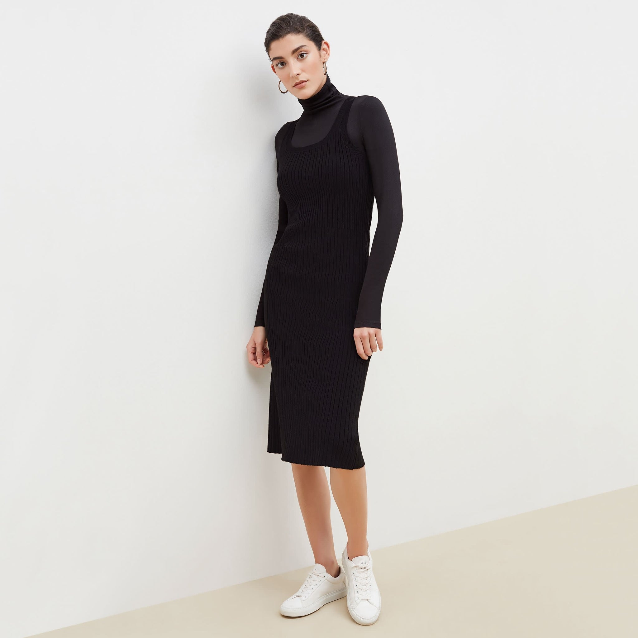 Front image of a woman standing wearing the Gwen Dress in Black