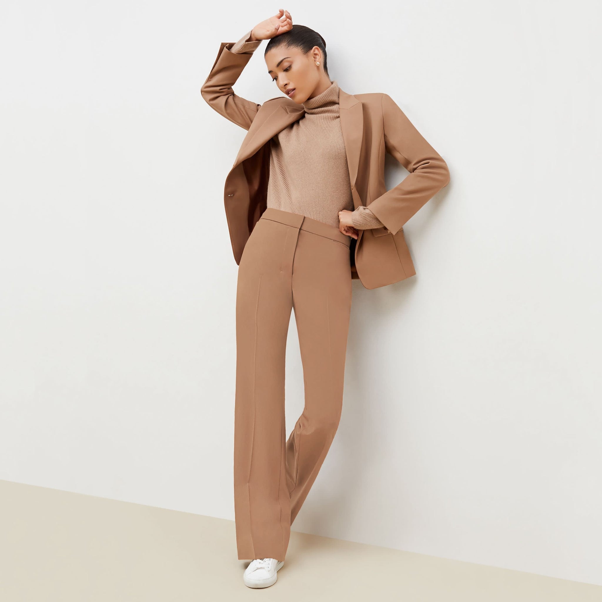 Front image of a woman standing wearing the Horton Pant-Washable Wool Twill in camel 