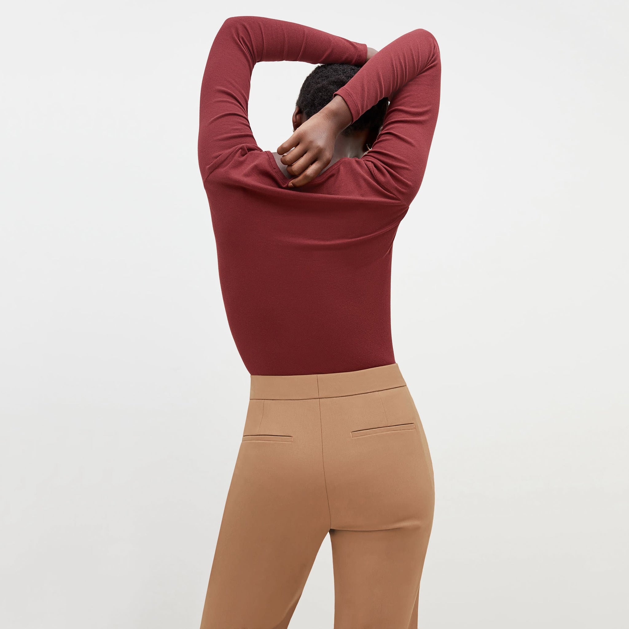 Back image of a woman standing wearing the Horton Pant-Washable Wool Twill in camel