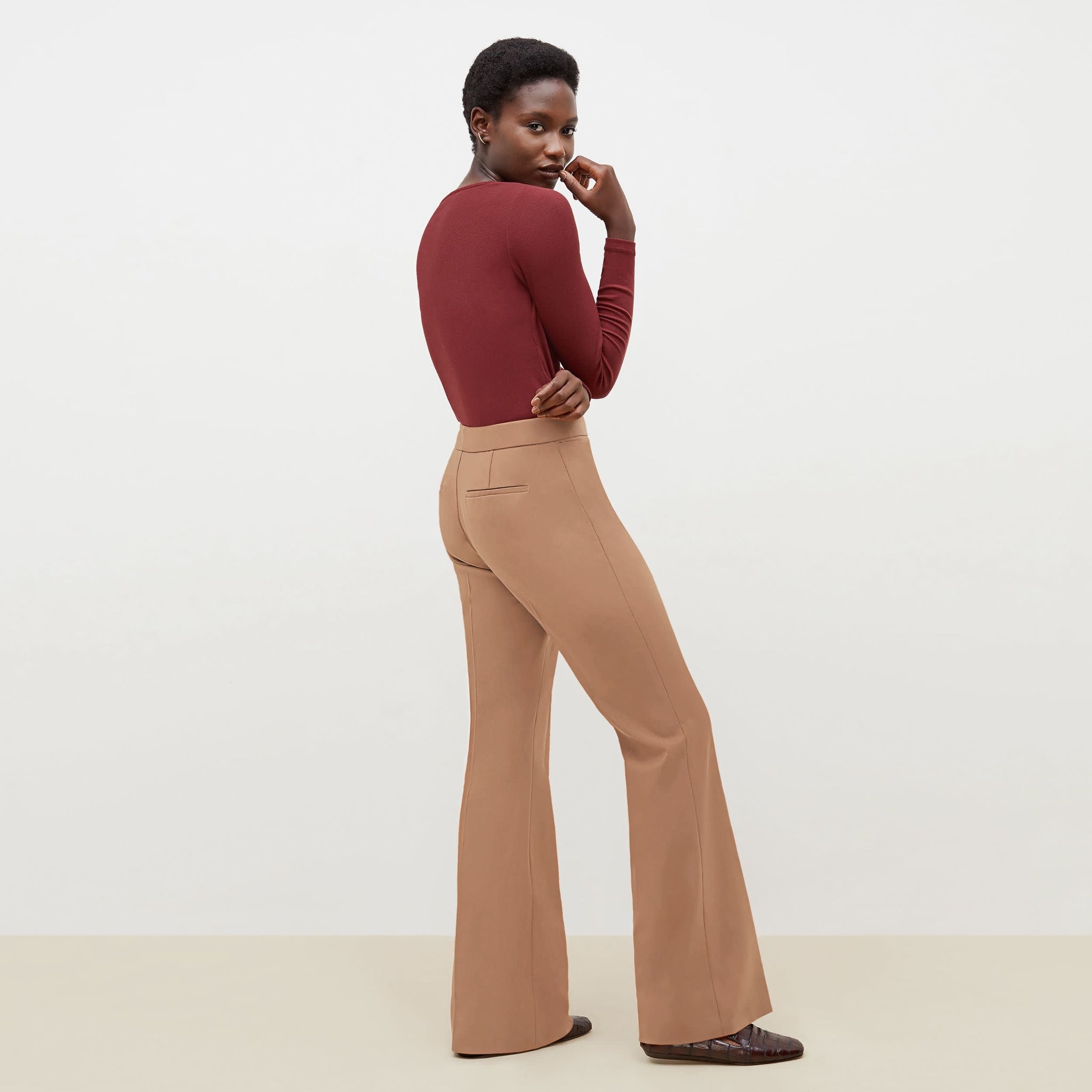 Side image of a woman standing wearing the Horton Pant-Washable Wool Twill in camel