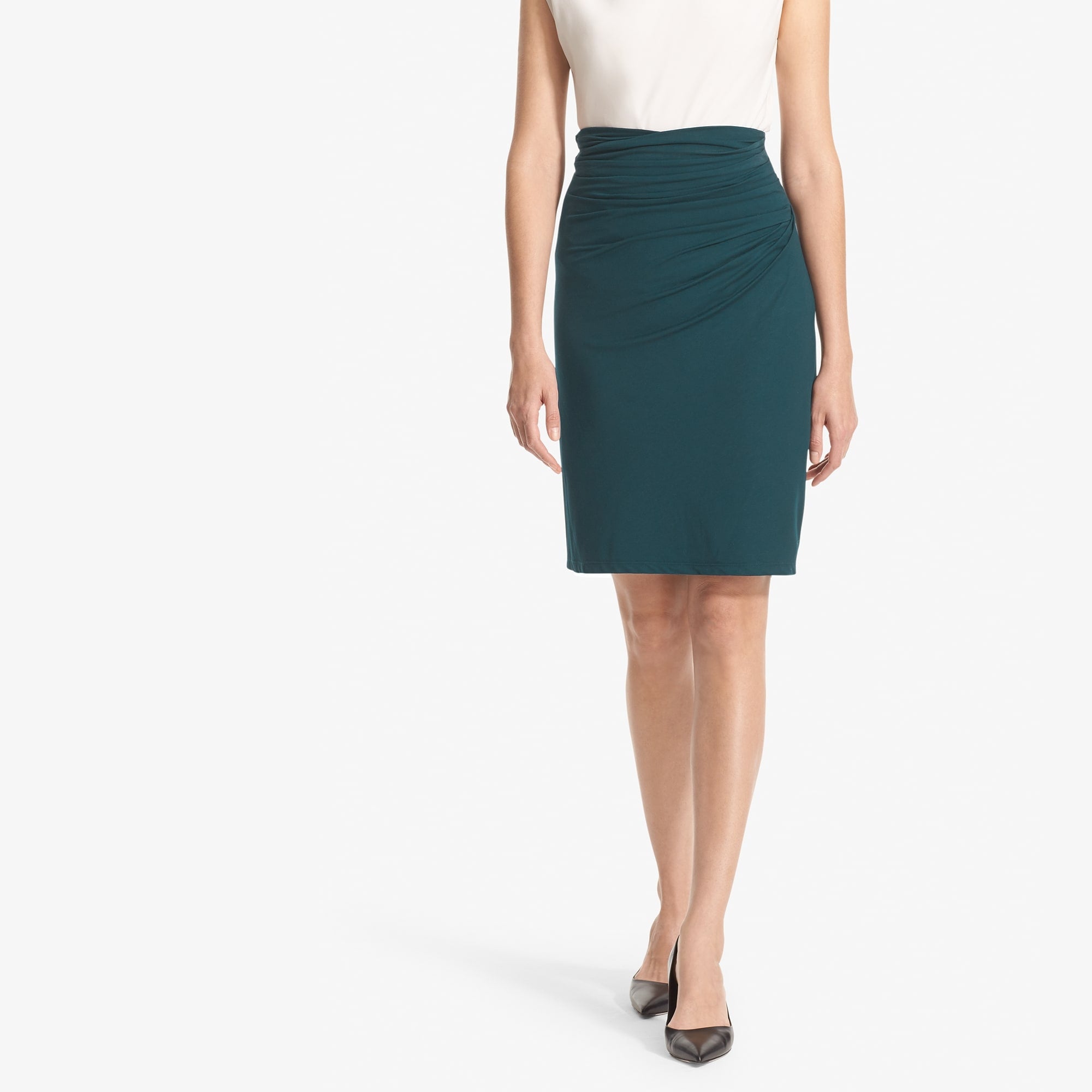 Front image of a woman standing wearing the Soho Skirt in Rainforest 