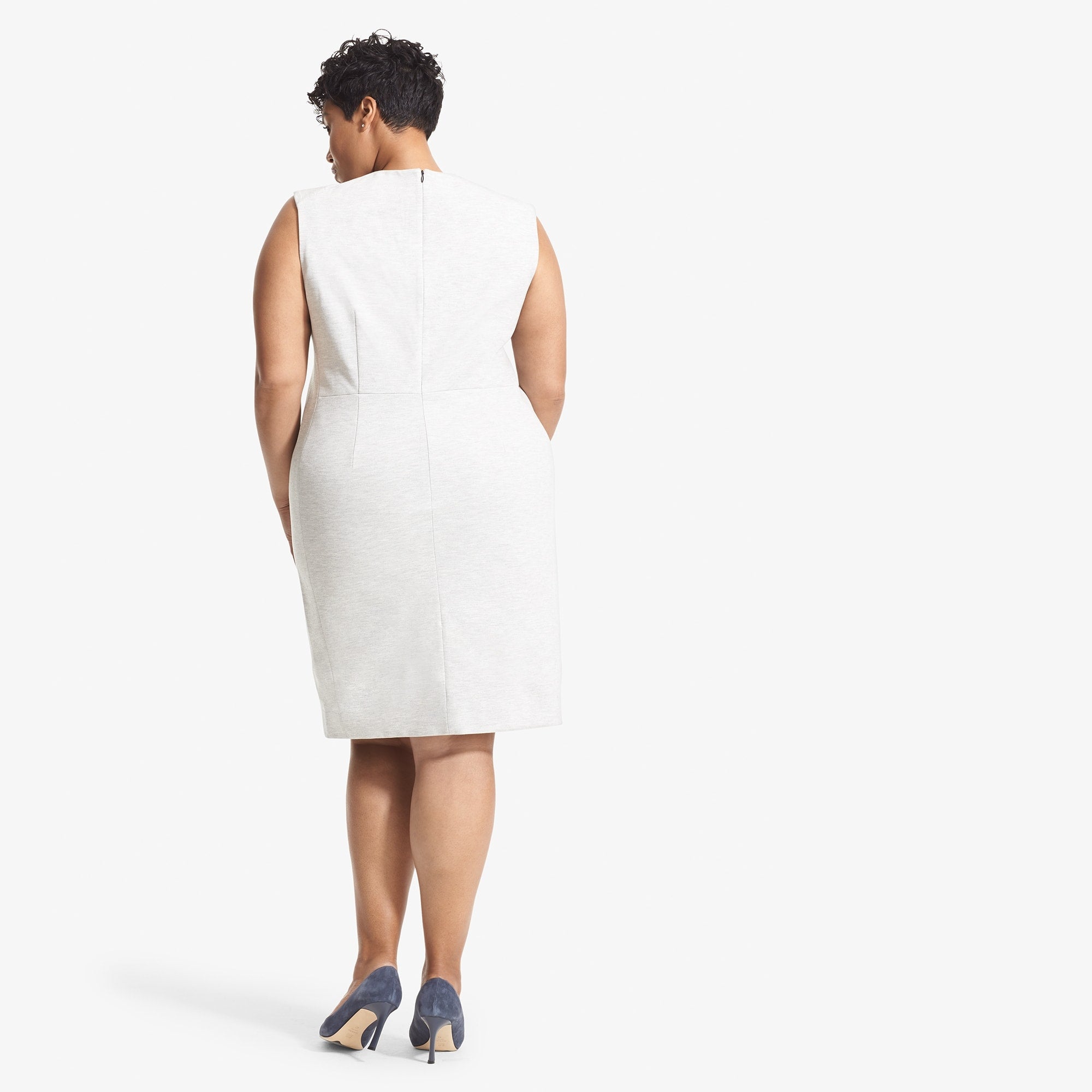 Back image of a woman standing wearing the Katie Dress--Twill Ponte in Light Heather Gray