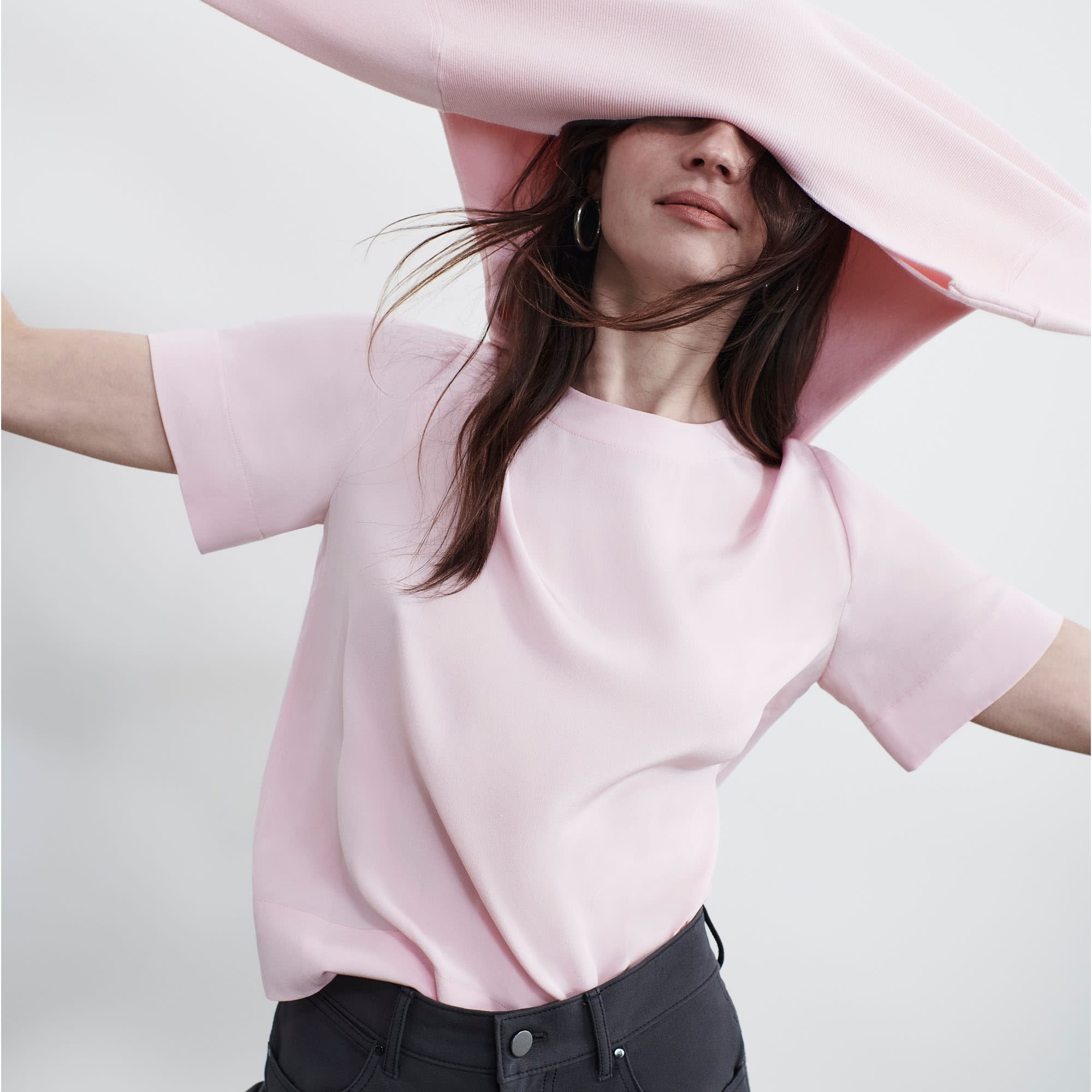 Front image of a woman standing wearing the Annika Tee—Washable Silk in Rosewater