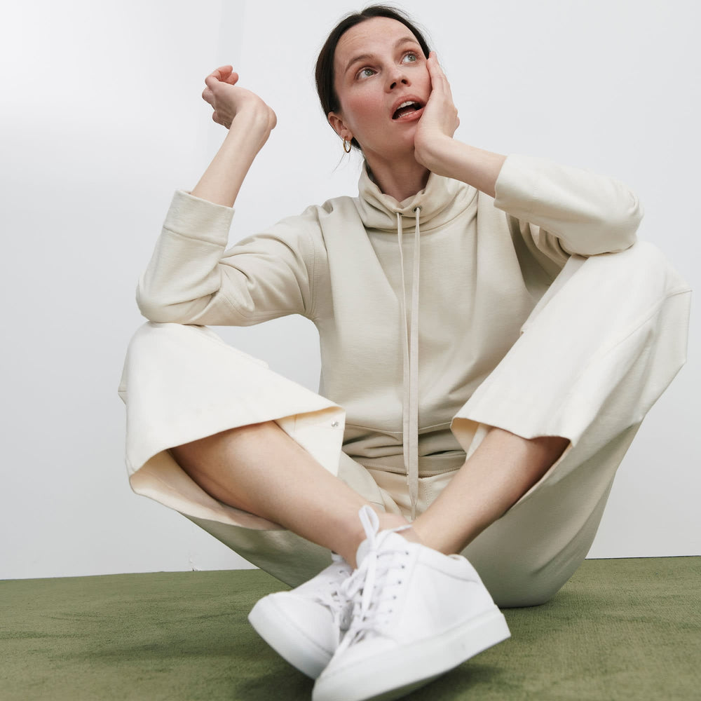 Front image of a woman standing wearing the Harris Sweatshirt—Fine Terry in Pearl
