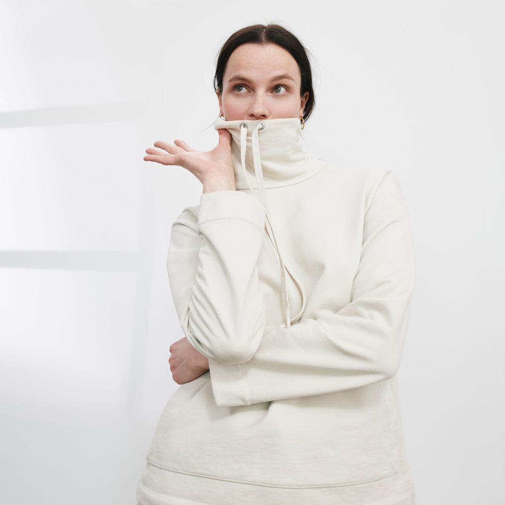 Front image of a woman standing wearing the Harris Sweatshirt—Fine Terry in Pearl