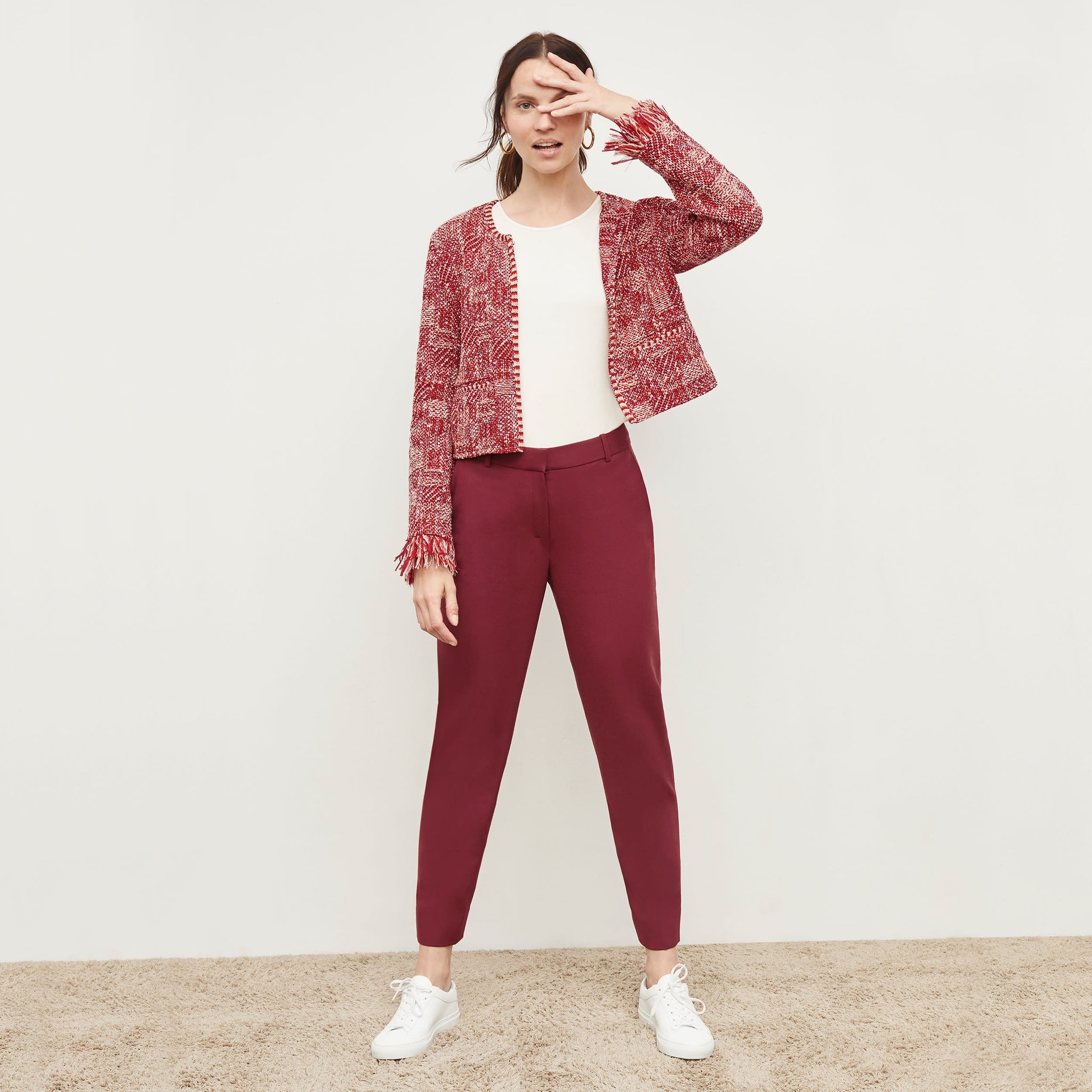 Front image of a woman standing wearing the Lilia Jacket—Interweave in Red Multi