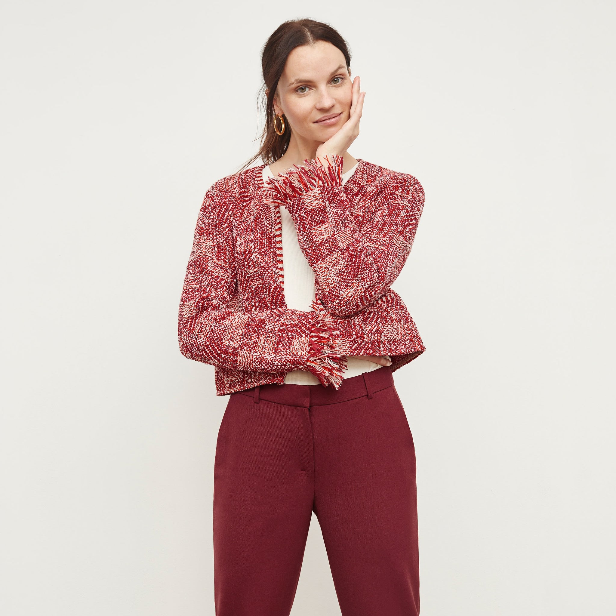 Front image of a woman standing wearing the Lilia Jacket—Interweave in Red Multi 