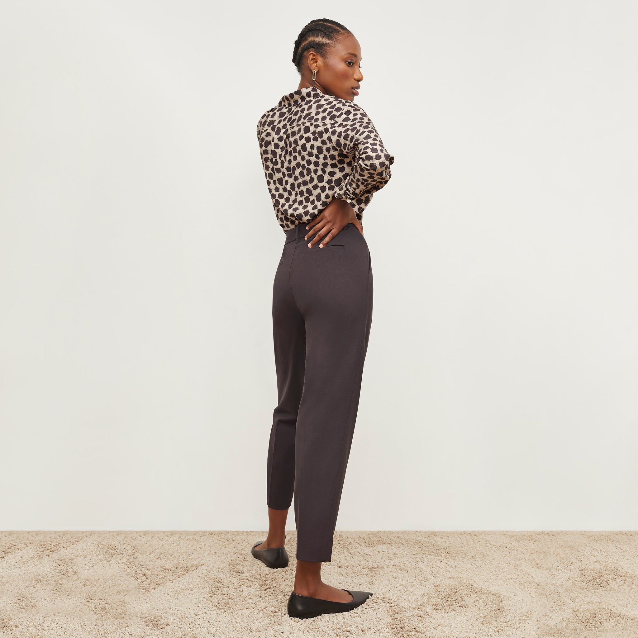 Back image of a woman standing wearing the Mejia Pant in Haze