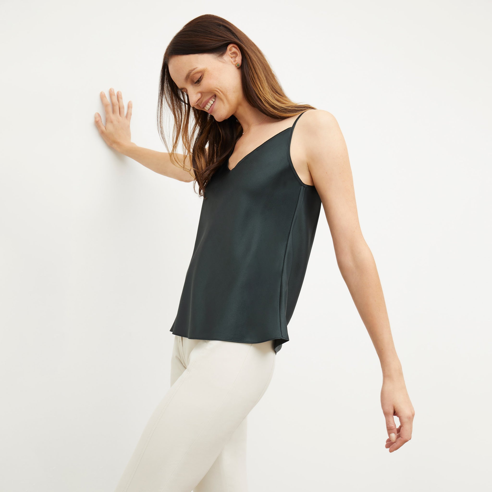 Side image of a woman standing wearing the lisey top in hunter