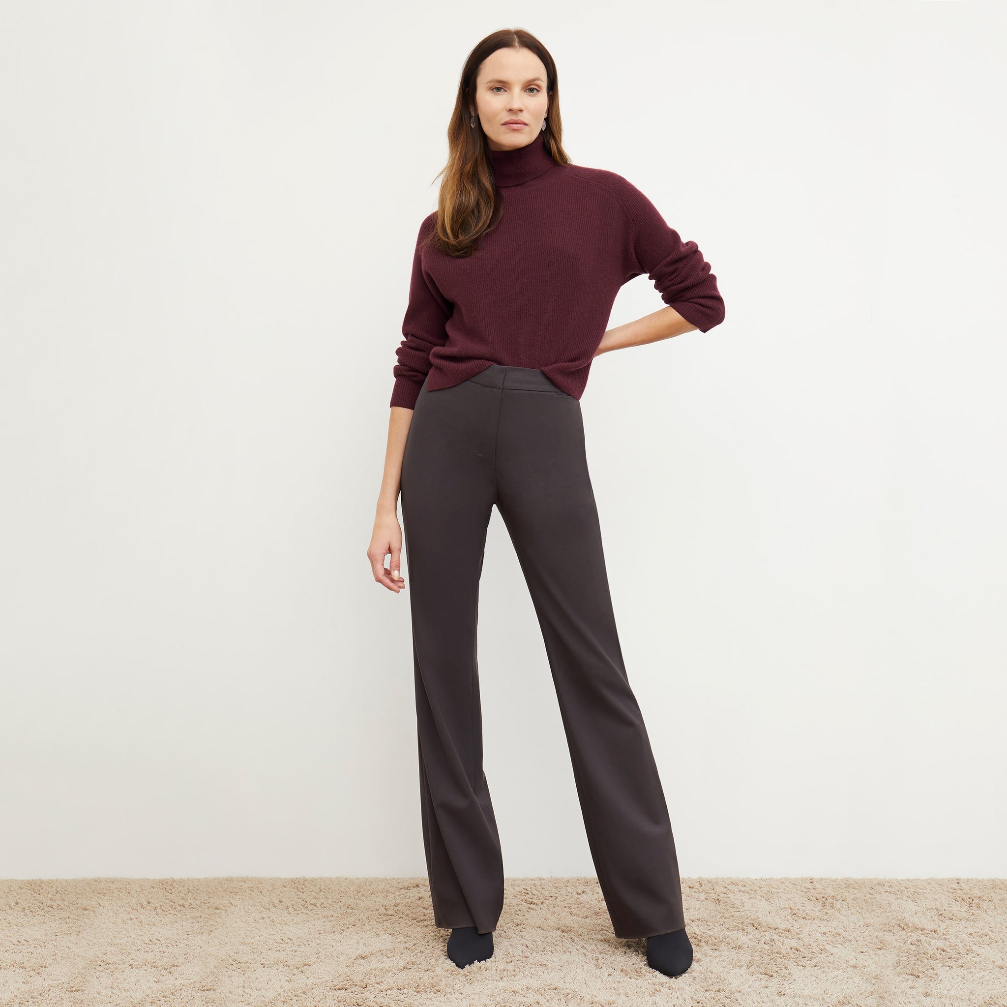 Front image of a woman standing wearing the arbus in chiante 