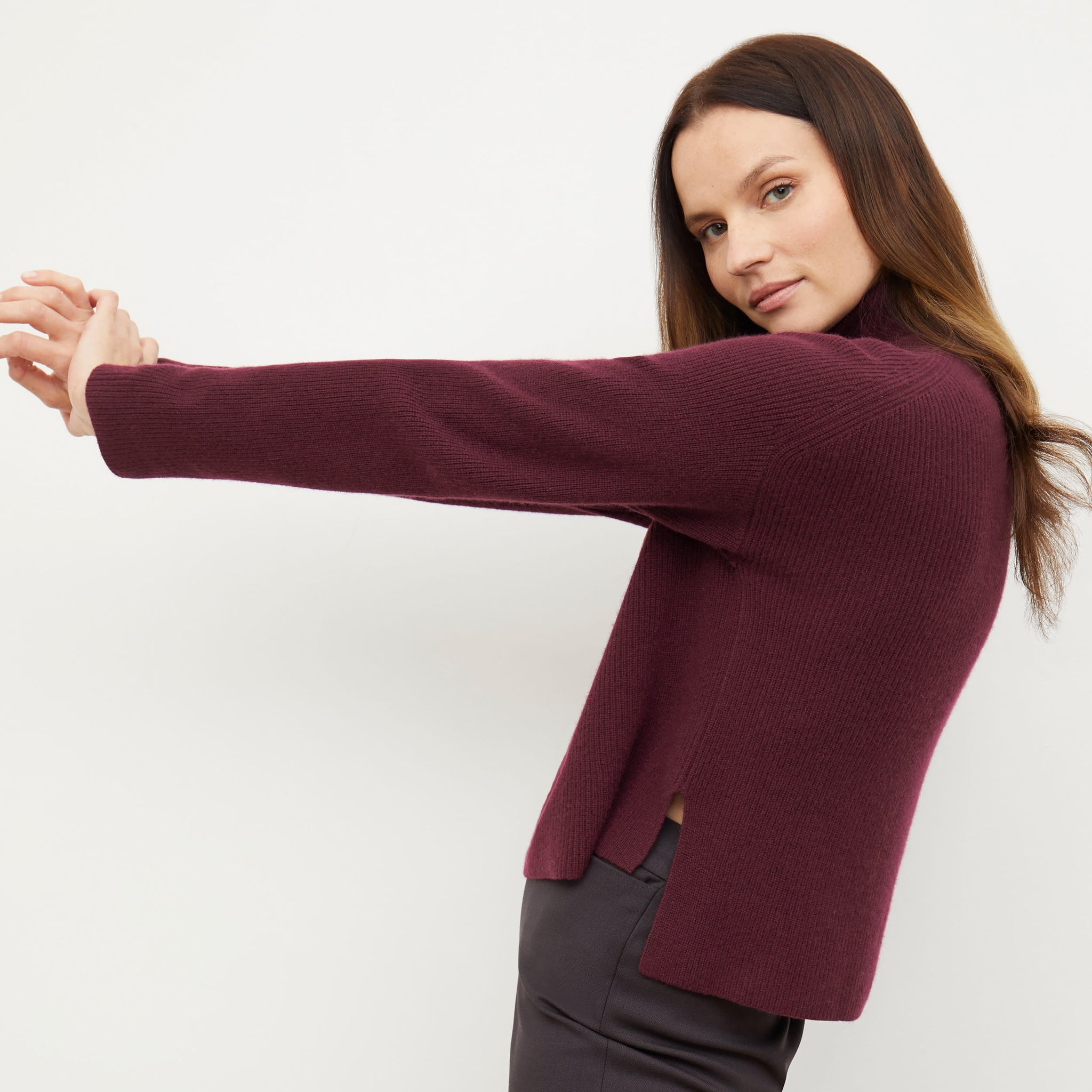 Side image of a woman standing wearing the arbus in chiante
