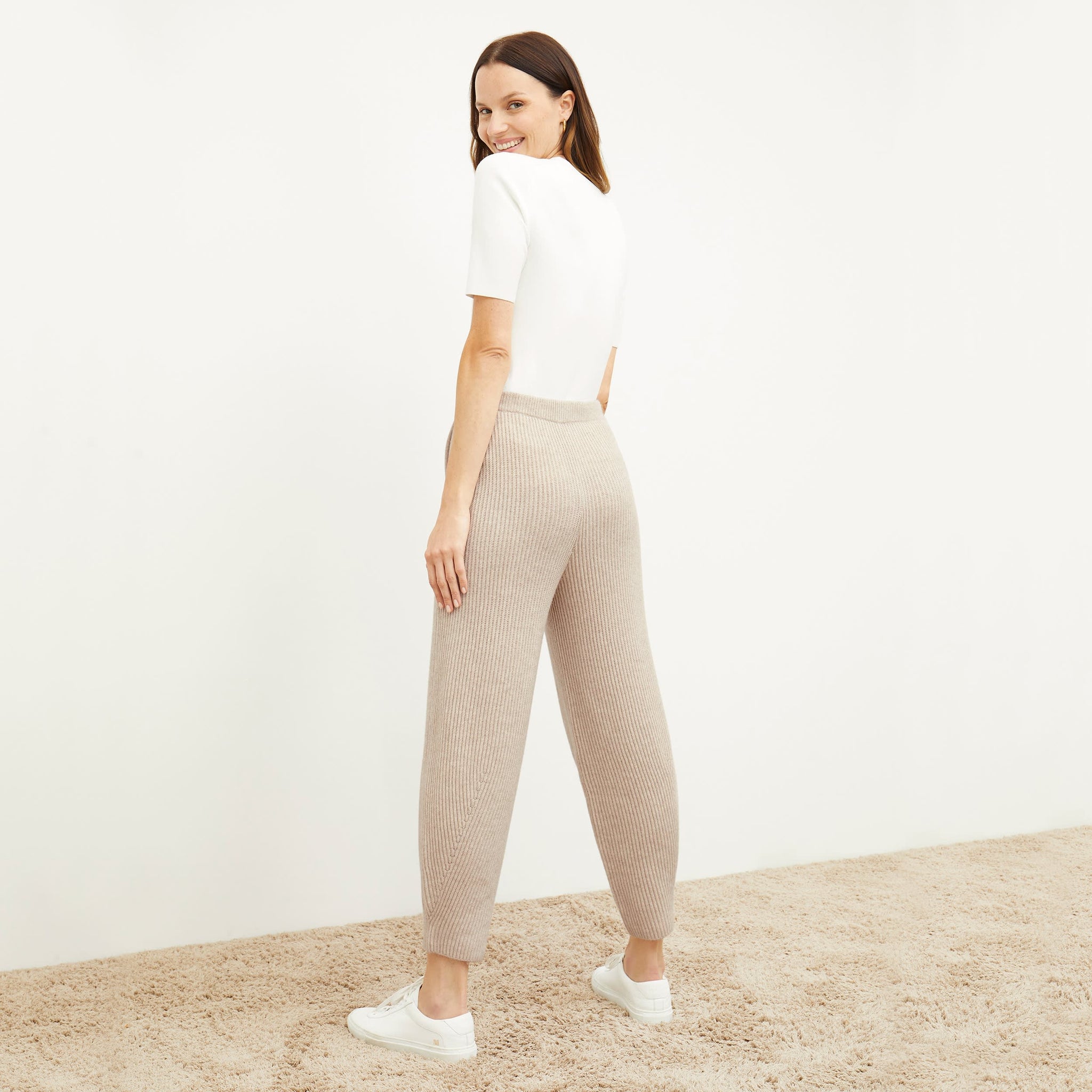 Back image of a woman standing wearing the Addison Jogger—Cashmere/Wool in Oatmeal Melange