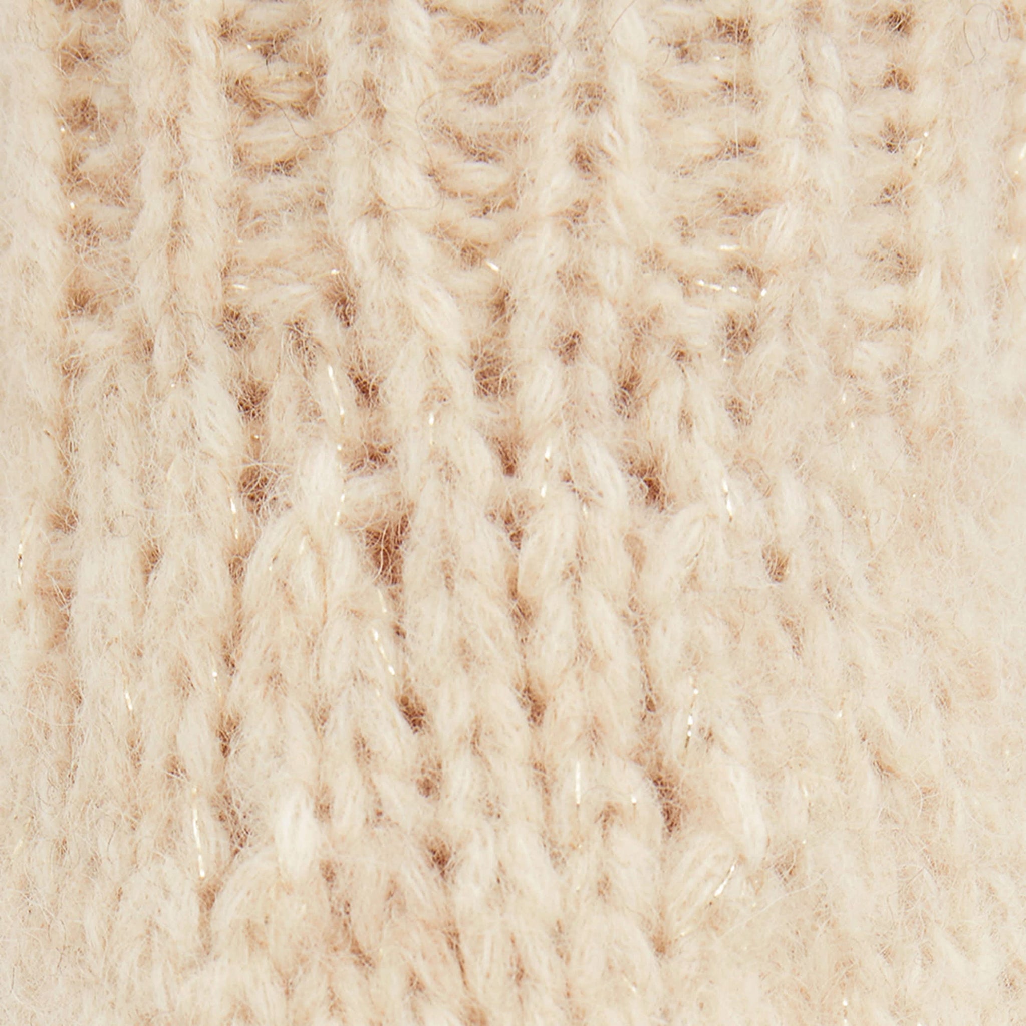 Detail image of a woman standing wearing the Cathy Sweater—Glimmer Alpaca in Jasmine