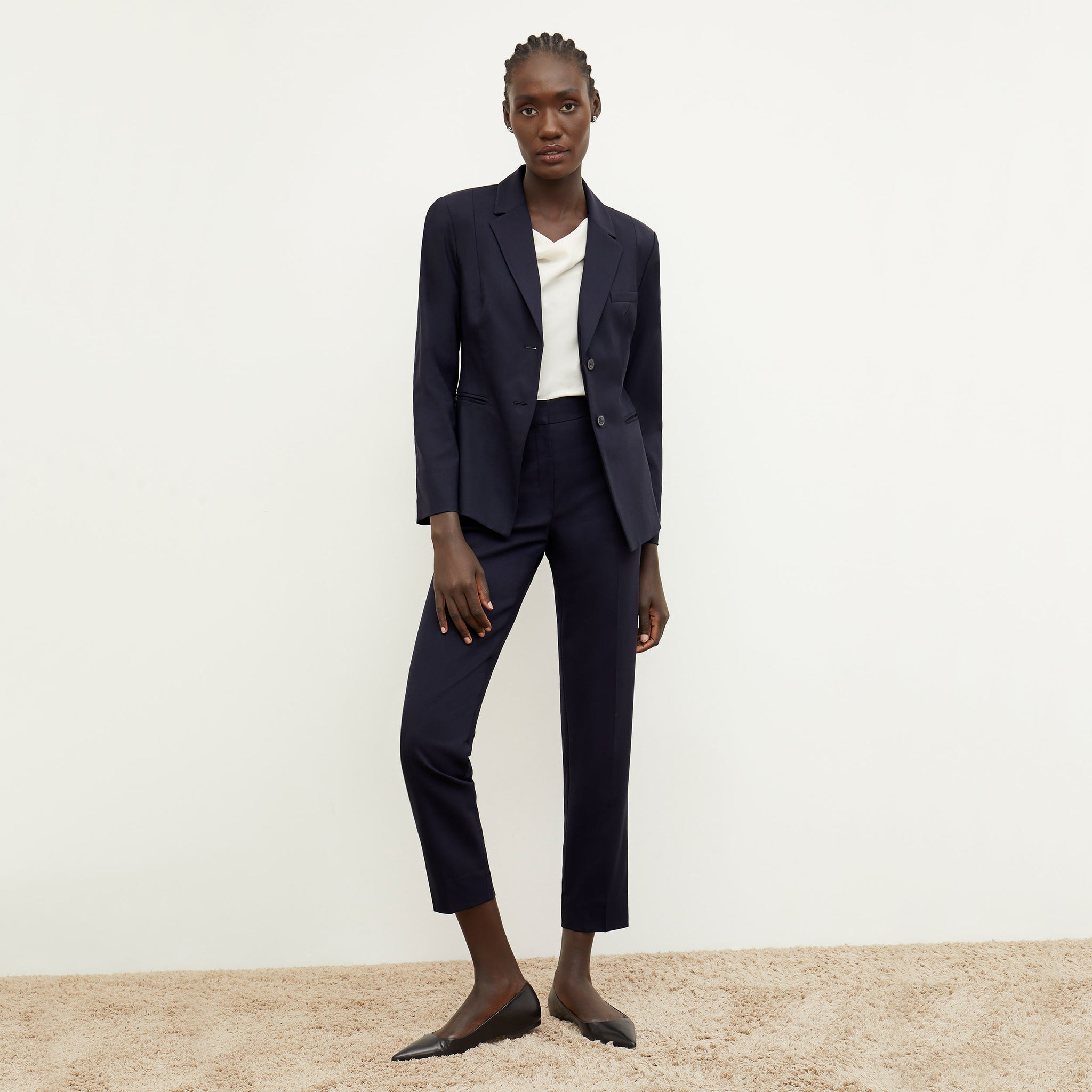 Front image of a woman standing wearing the Hoffman blazer in Galaxy Blue