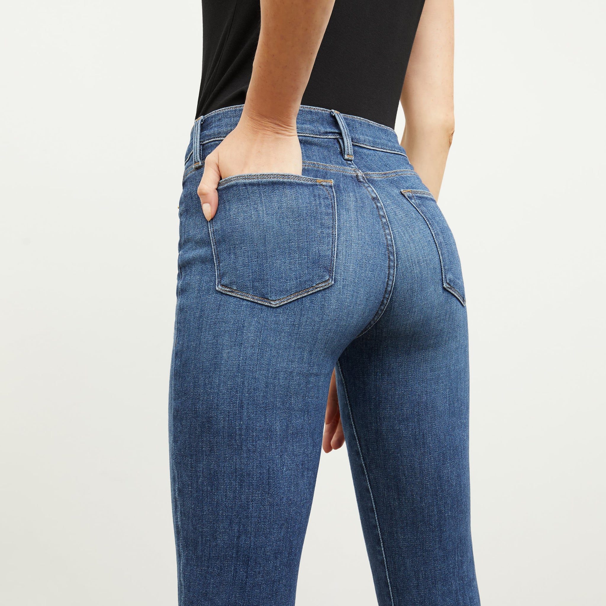 Back image of a woman standing wearing the FRAME Denim Le High Straight in Bestia