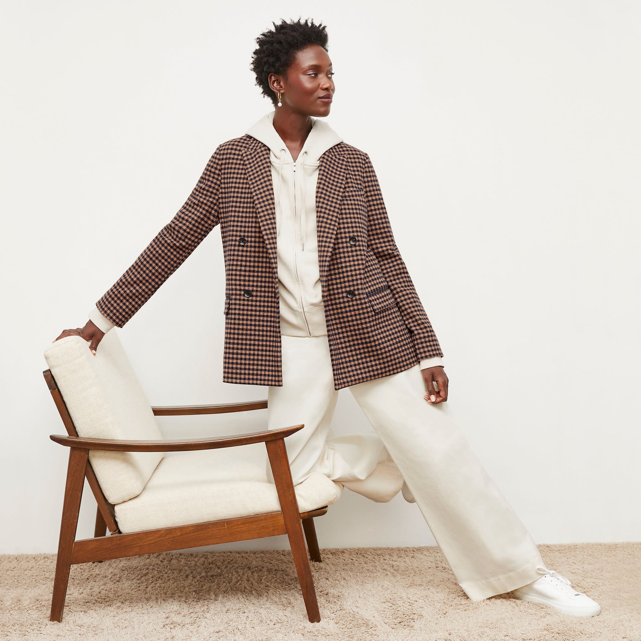 Front image of a woman standing wearing the O'Hara Blazer—Plaid Knit in Camel / Black