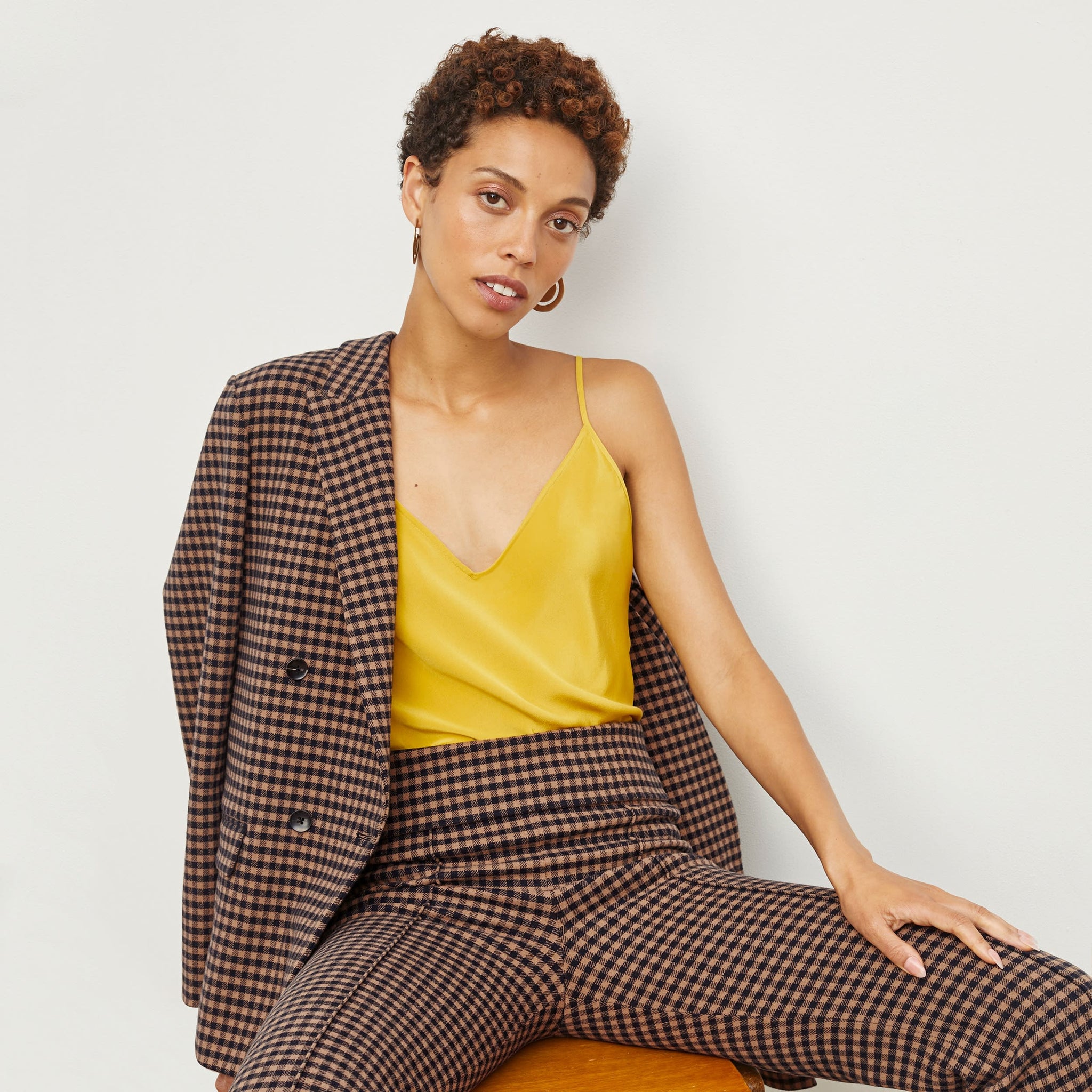 Front image of a woman standing wearing the O'Hara Blazer—Plaid Knit in Camel / Black