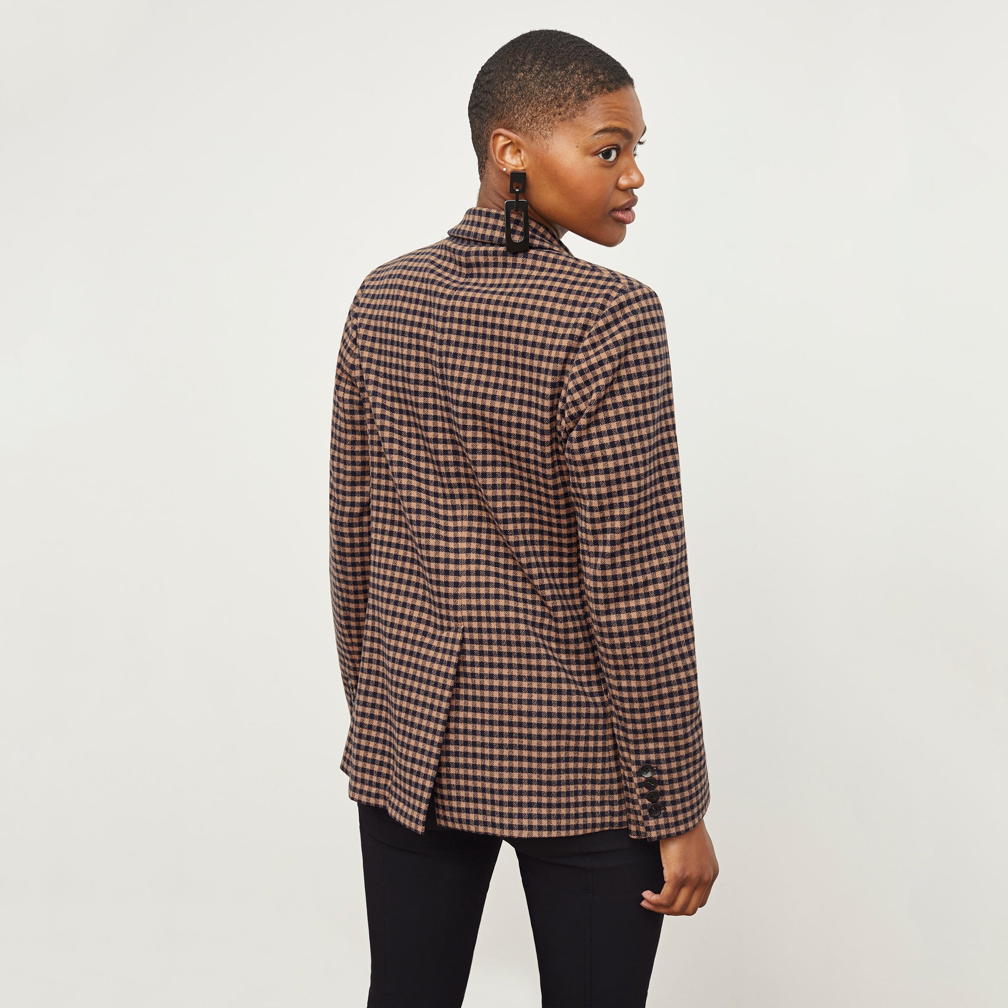 Back image of a woman standing wearing the O'Hara Blazer—Plaid Knit in Camel / Black