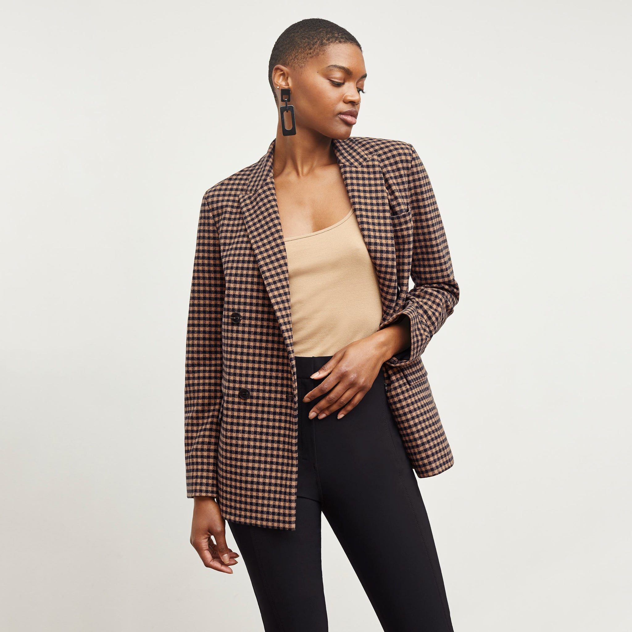 Front image of a woman standing wearing the O'Hara Blazer—Plaid Knit in Camel / Black