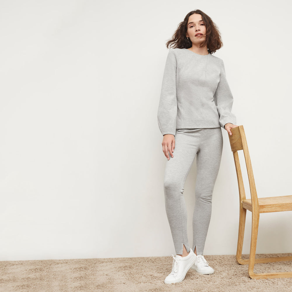 Front image of a woman standing wearing the Rashida Top in Gray Melange