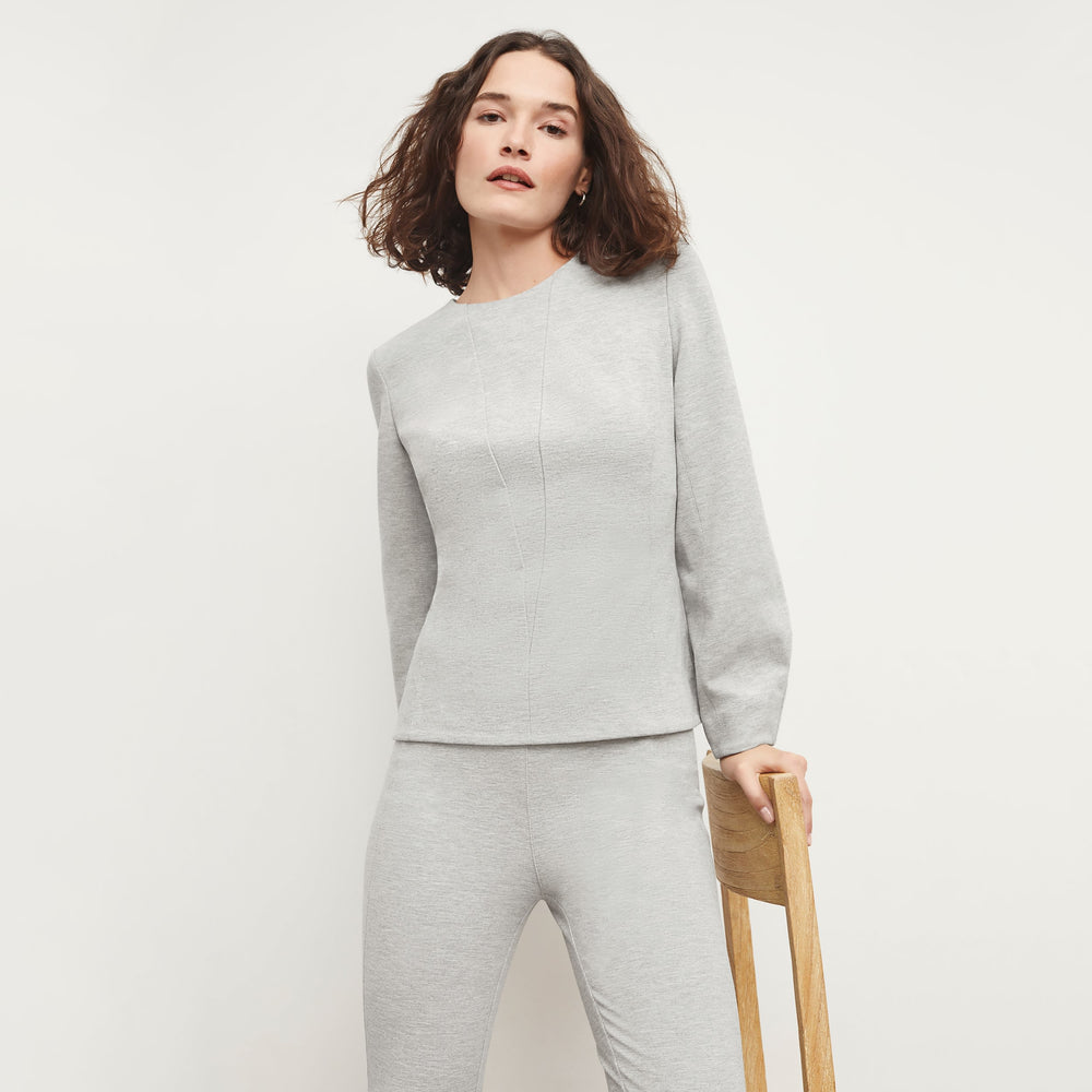 Front image of a woman standing wearing the Rashida Top in Gray Melange