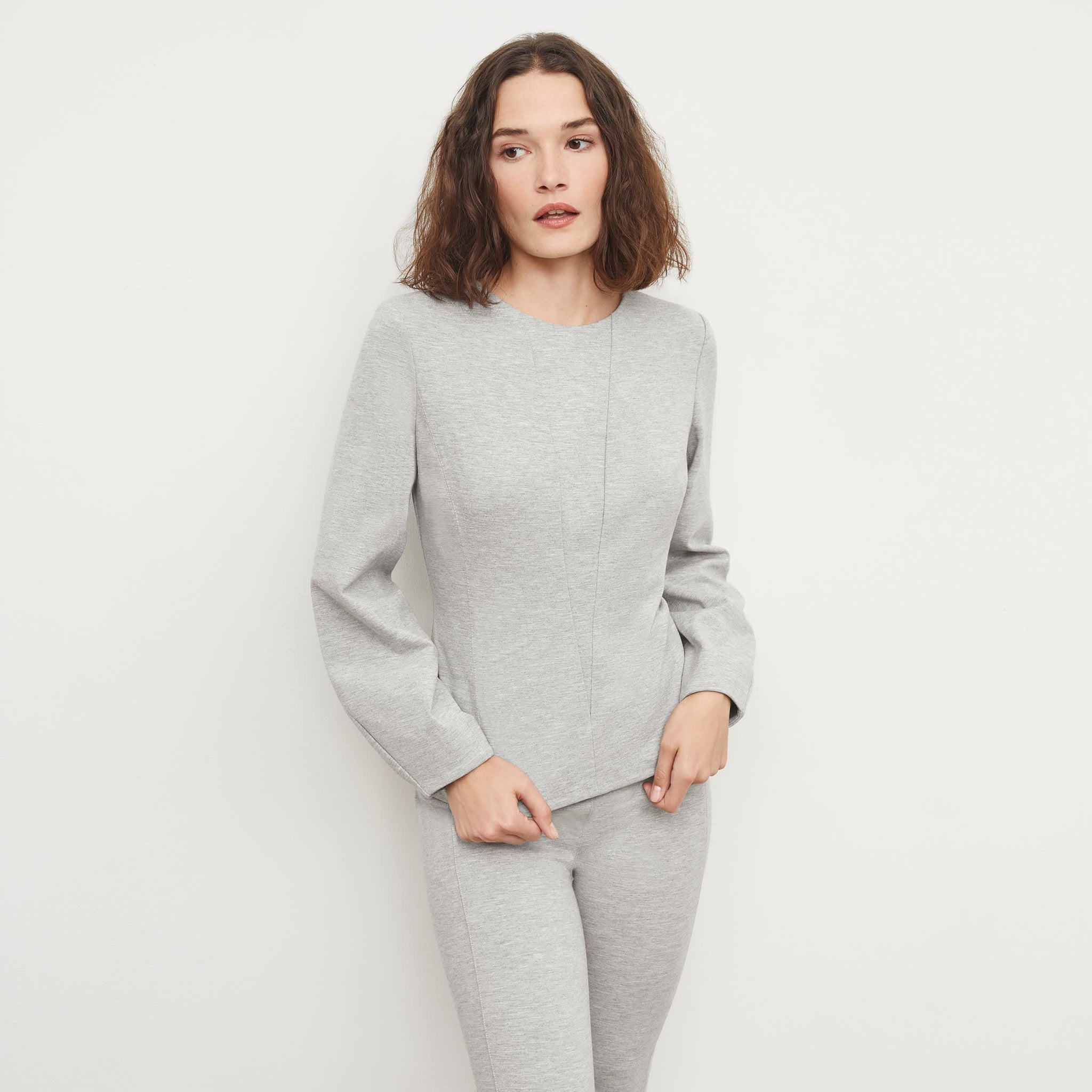 Front image of a woman standing wearing the Rashida Top in Gray Melange