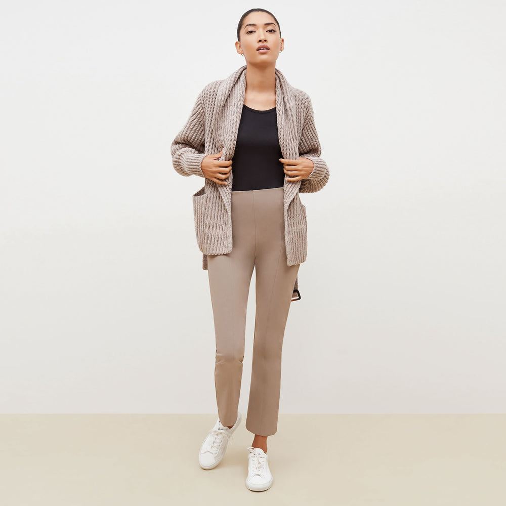 Front image of a woman standing wearing the Snyder Jacket—Lush Merino in Barley