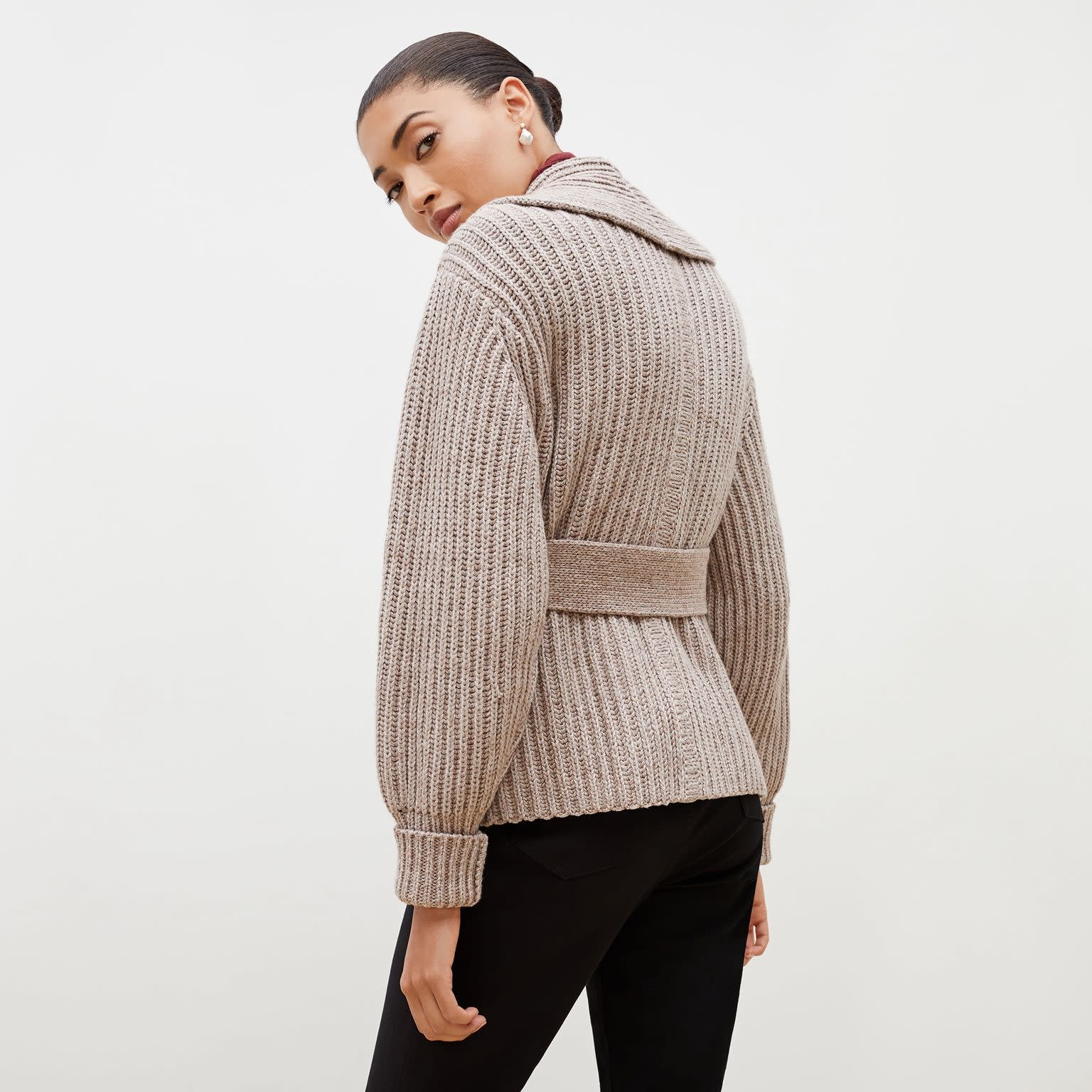 Back image of a woman standing wearing the Snyder Jacket—Lush Merino in Barley