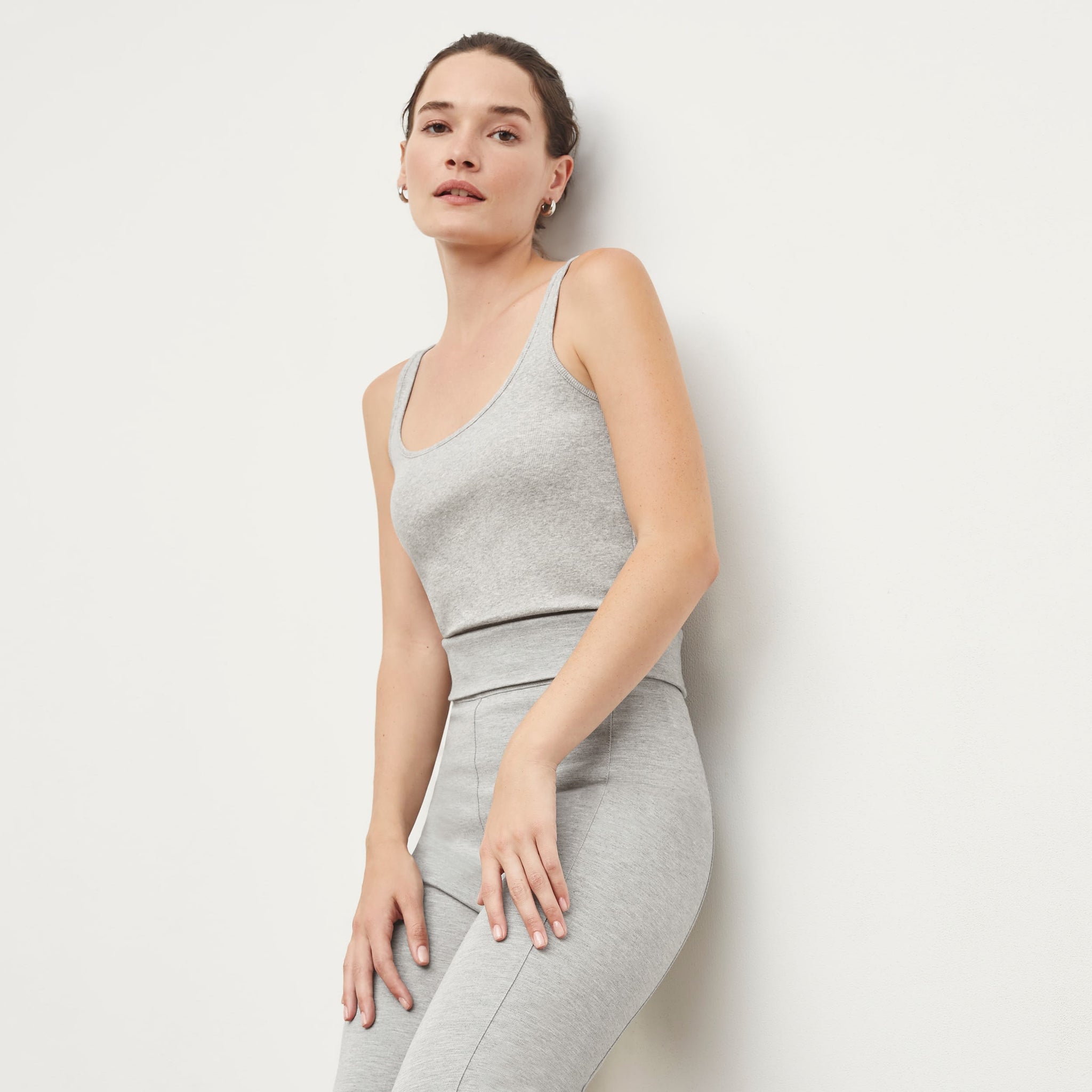 Side image of a woman standing wearing the Stella Legging in Gray Melange