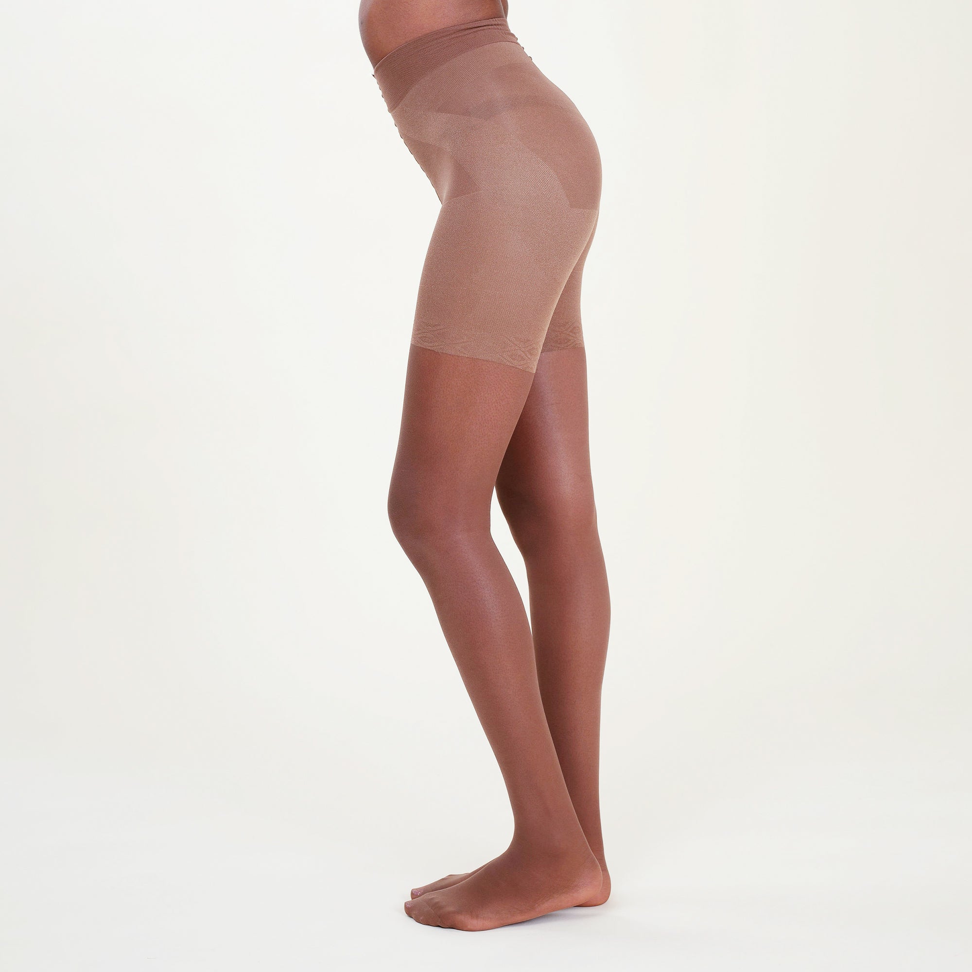 Image of a woman wearing the threads tights in sheer espresso